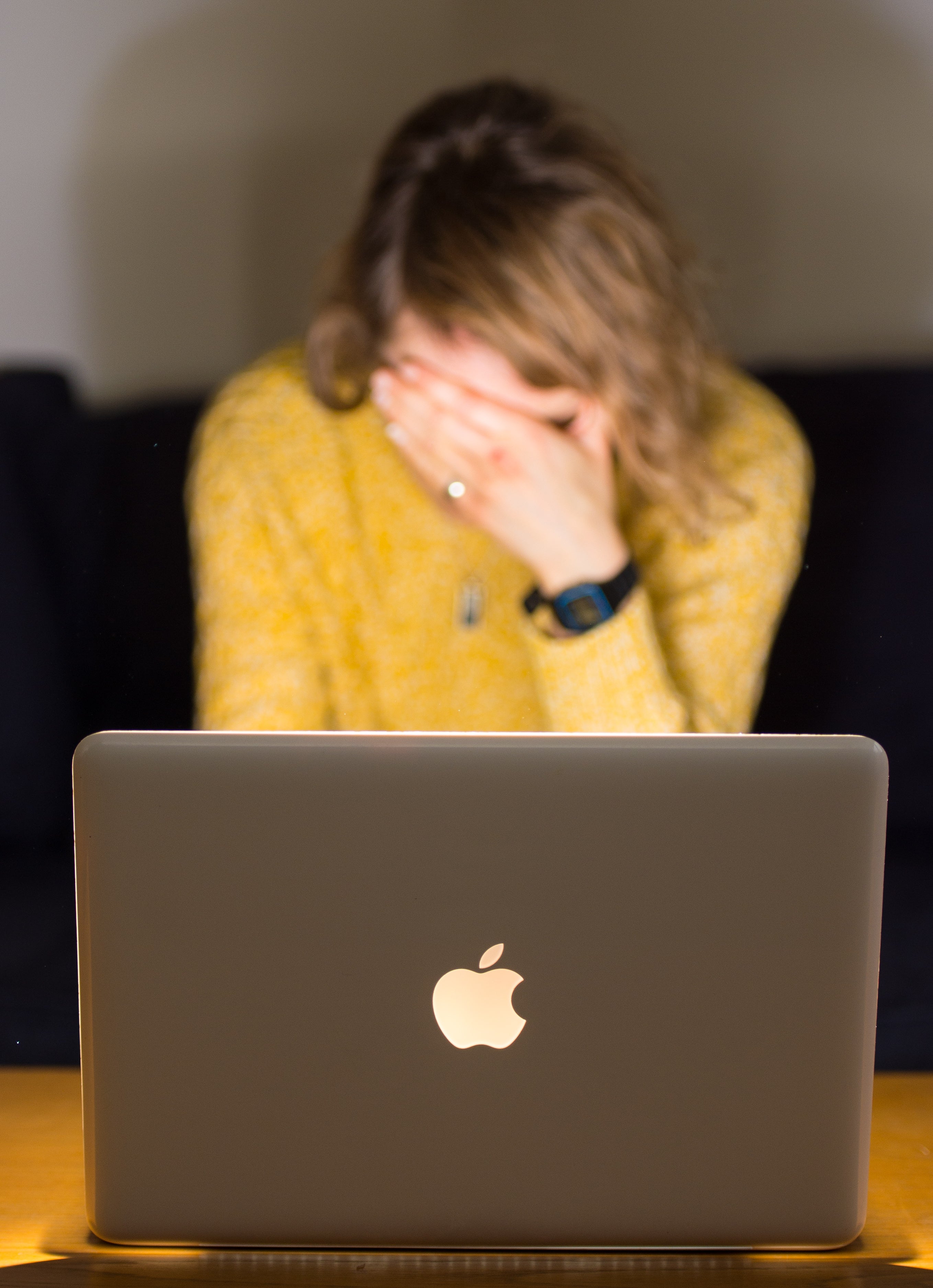 In a picture posed by a model, a woman looks stressed