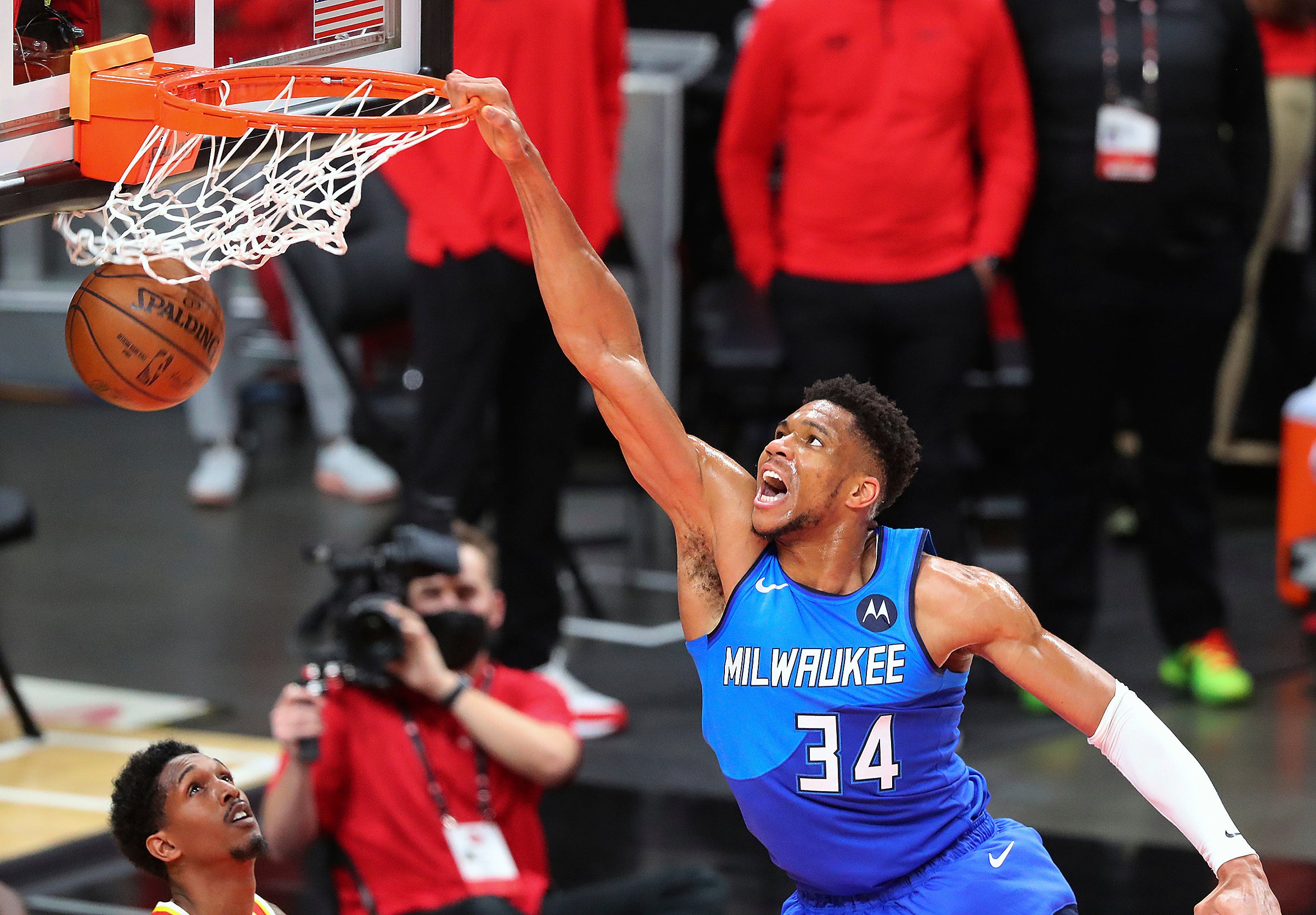 Milwaukee Bucks forward Giannis Antetokounmpo slams over Atlanta Hawks guard Lou Williams