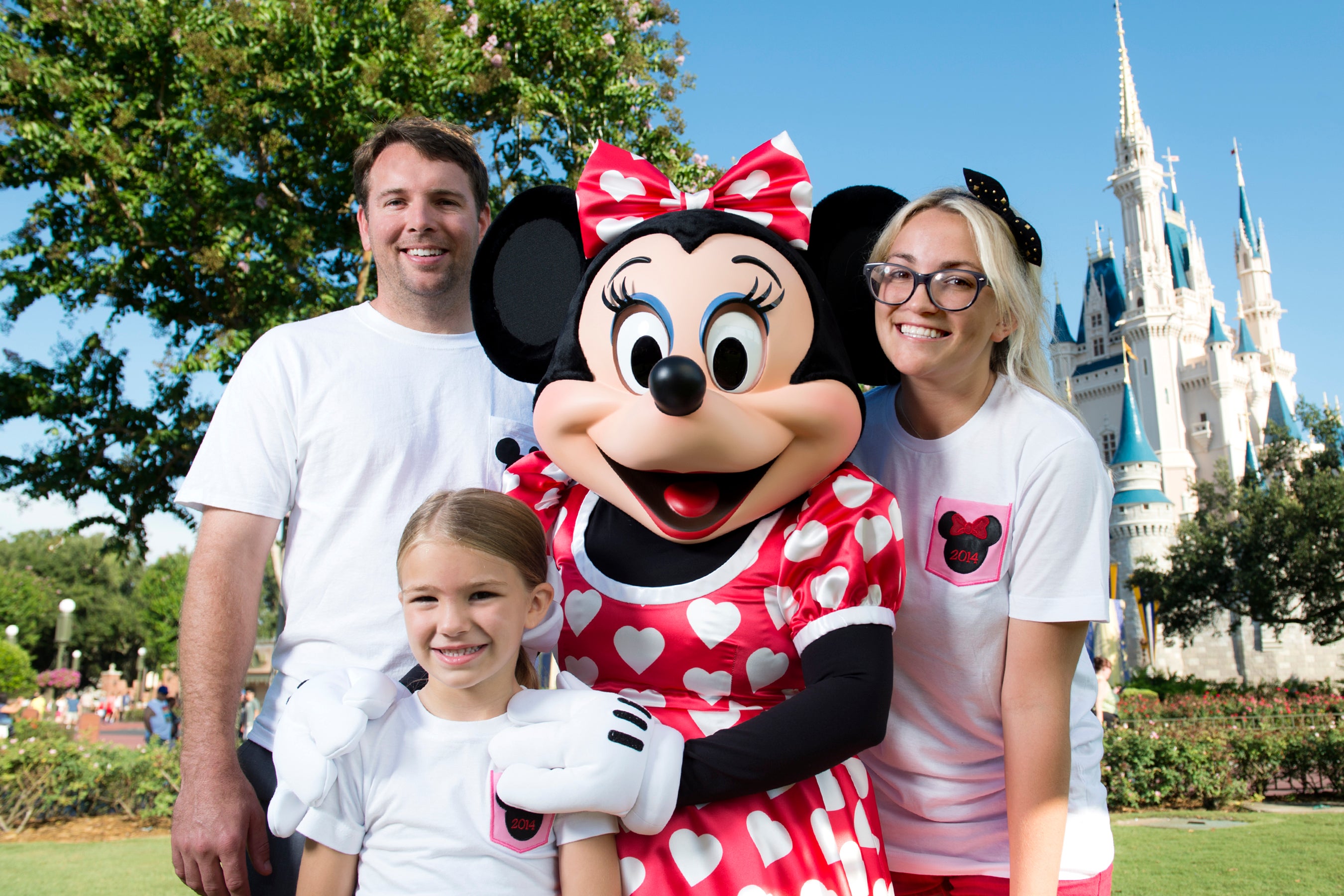 Jamie Lynn Spears poses with her husband and daughter at the Magic Kingdom park