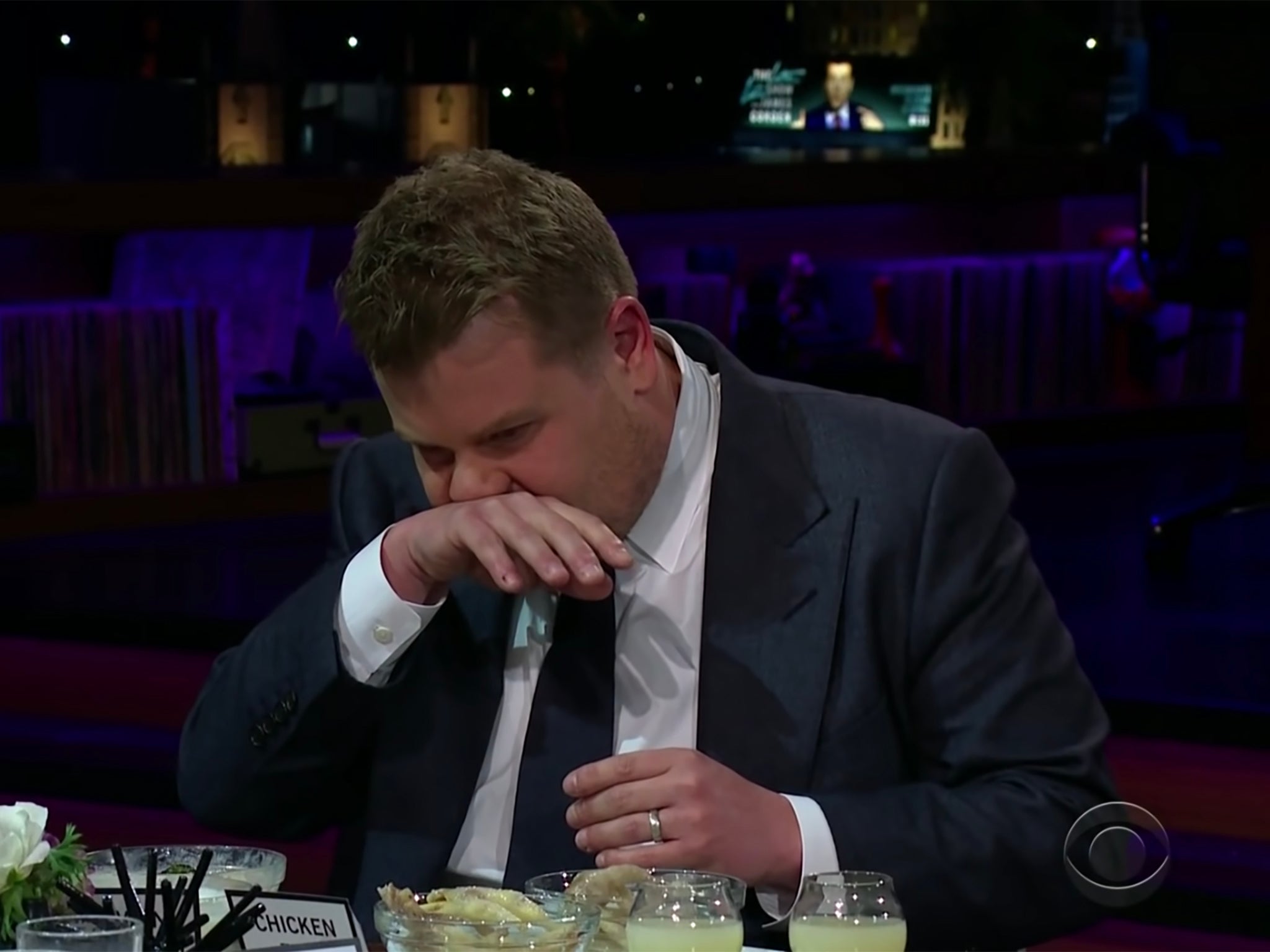 James Corden retches as he inspects chicken feet during “Spill Your Guts or Lose Your Guts"