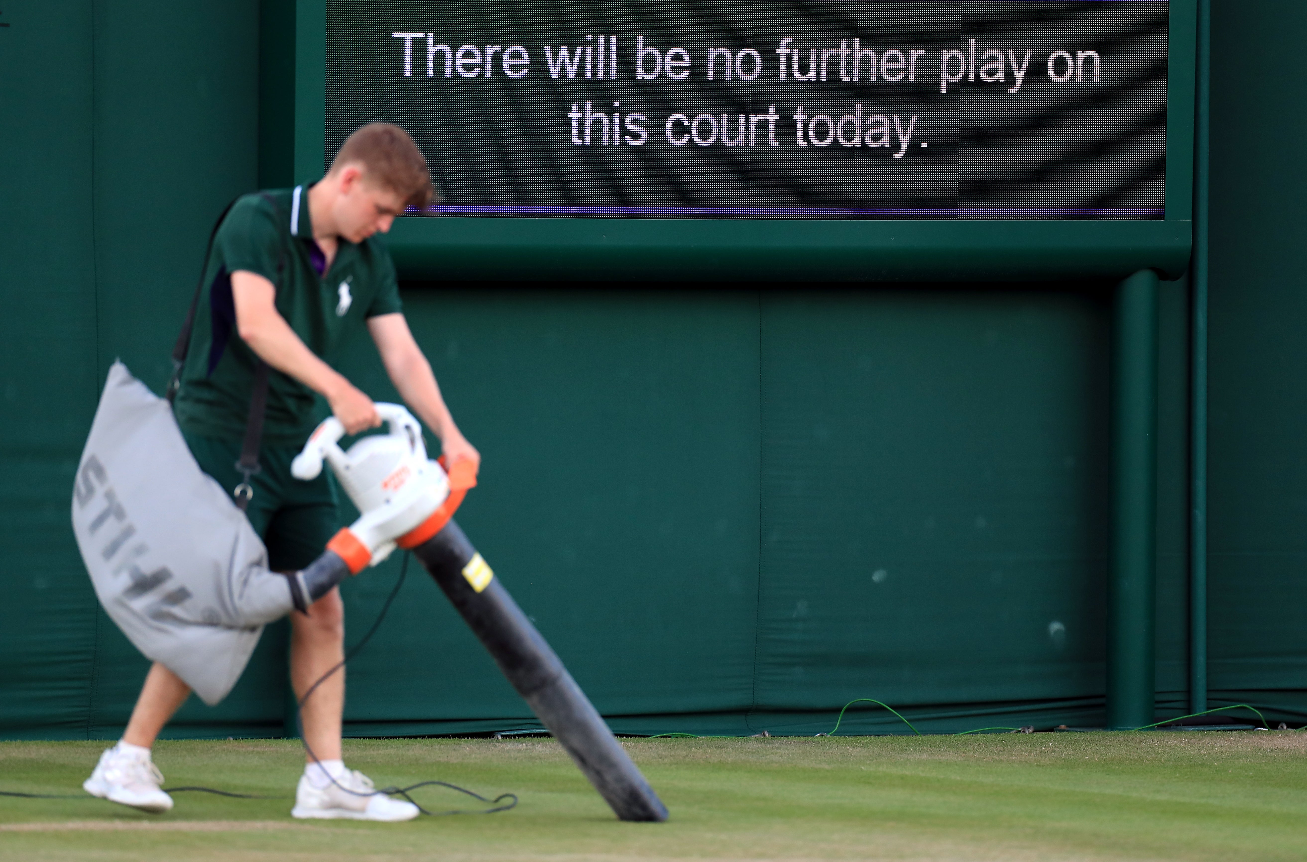 Ground staff work on the courts