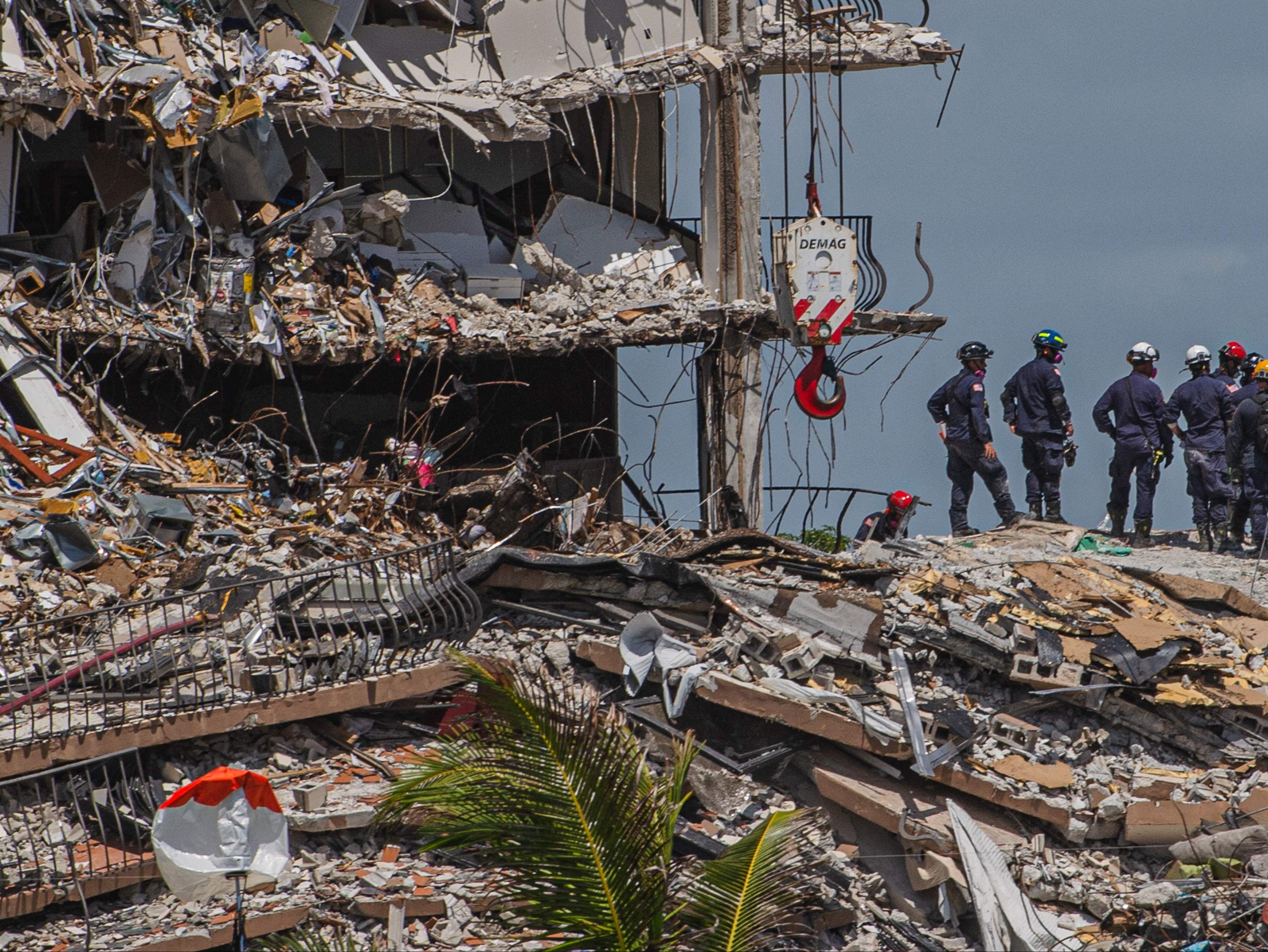 Rescuers at the wreckage of Champlain Towers South