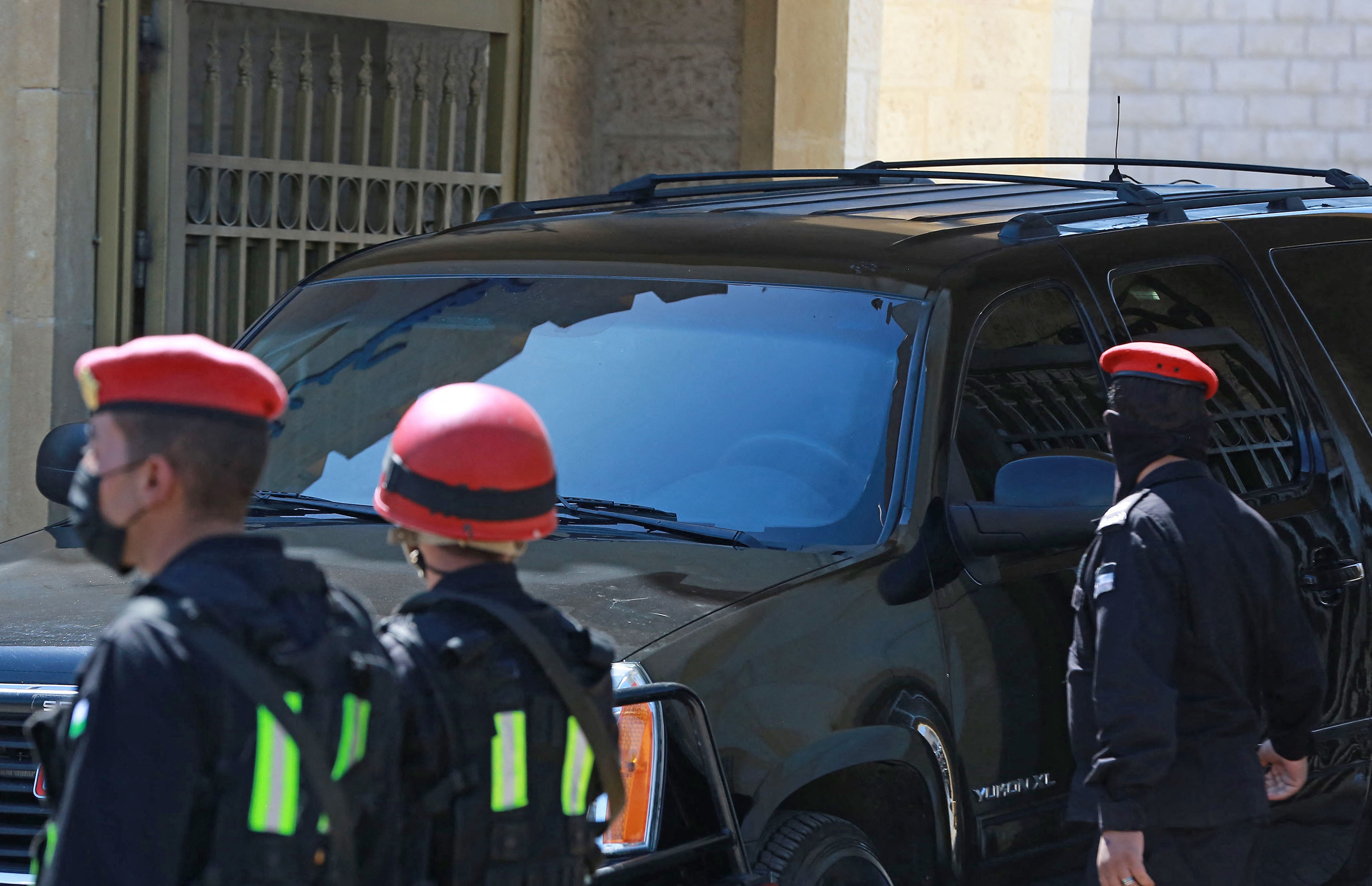 A vehicle with tinted windows leaves the State Security Court, where the trial of two officials accused of helping Jordan's Prince Hamzah try to overthrow his half-brother King Abdullah II began, in the Jordanian capital Amman