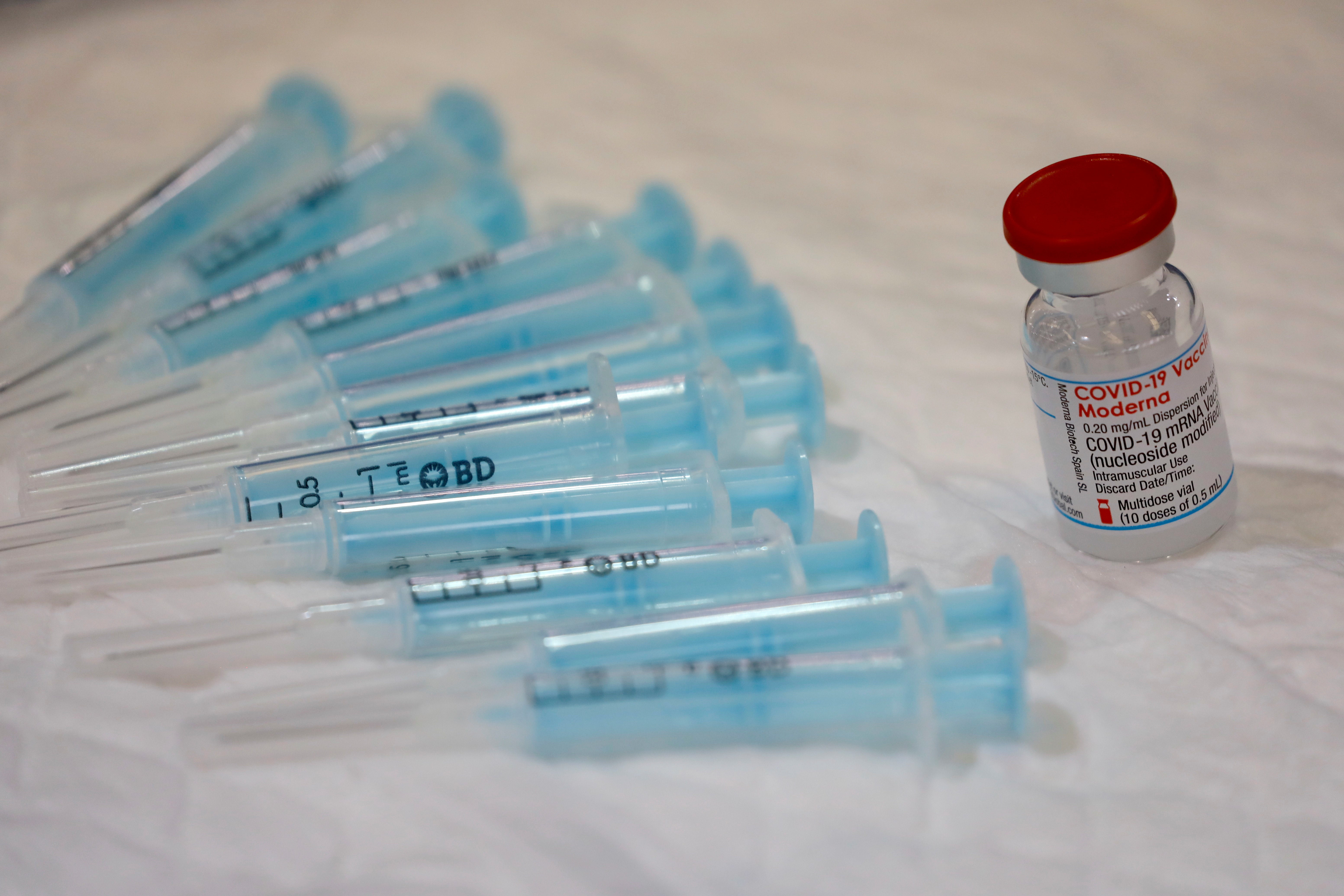 File: A vial containing doses of the Moderna vaccine seen at a vaccination centre in Spain on 9 June, 2021