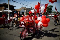 Discovery of indigenous bodies prompts calls to cancel Canada Day