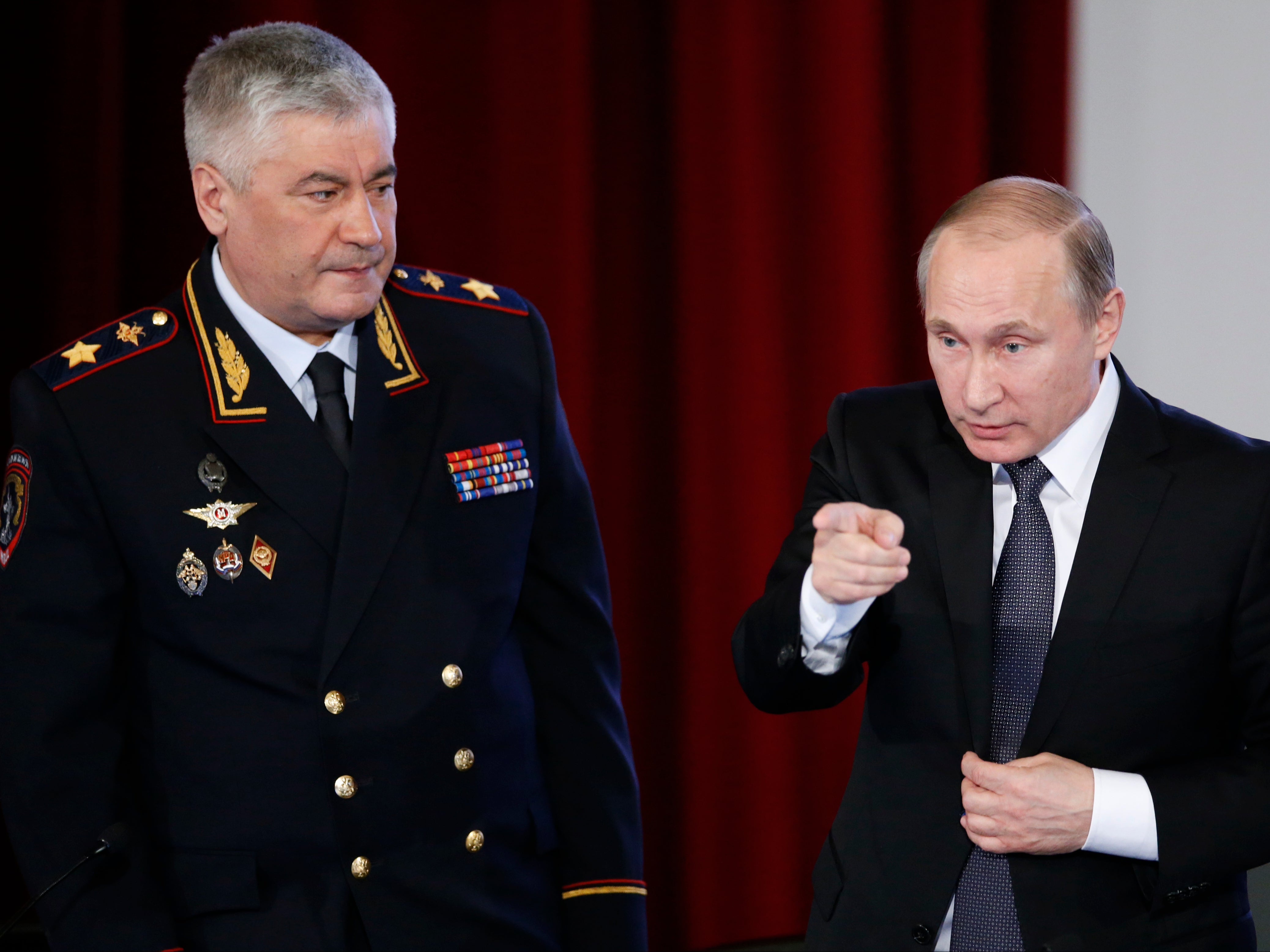 Russia’s interior minister Vladimir Kolokoltsev with Vladimir Putin