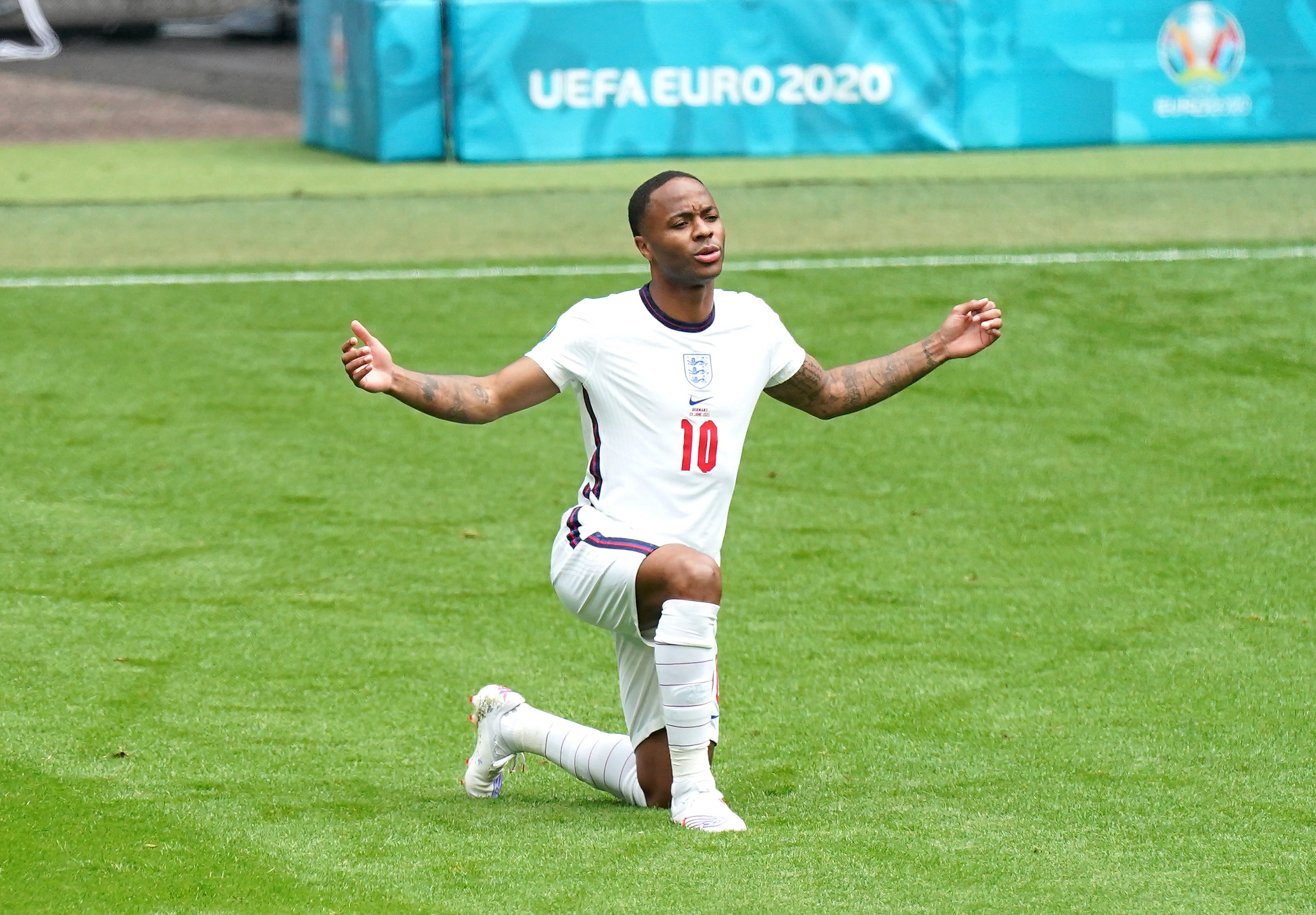 Raheem Sterling takes a knee