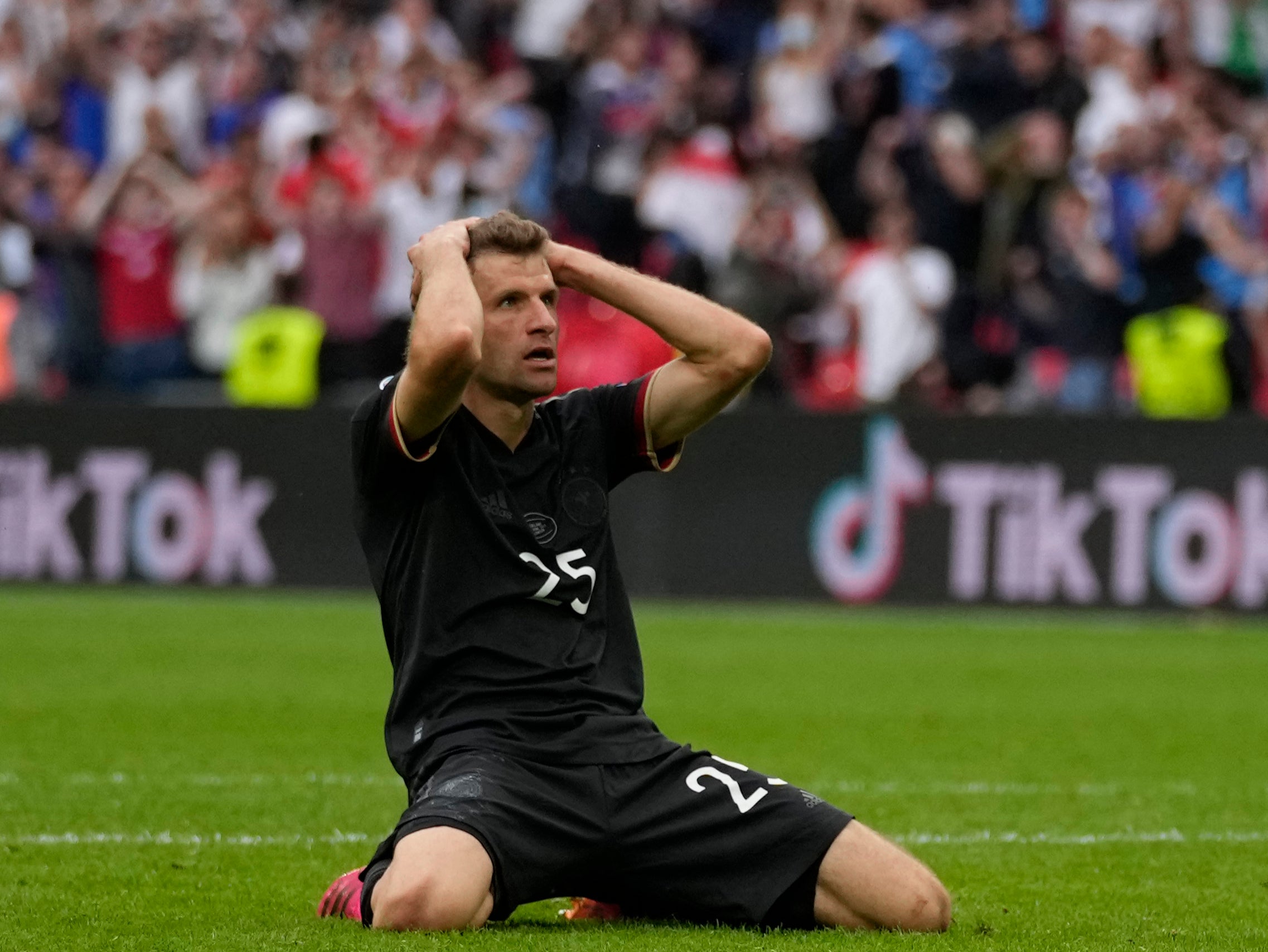 Thomas Muller reacts after his miss against England