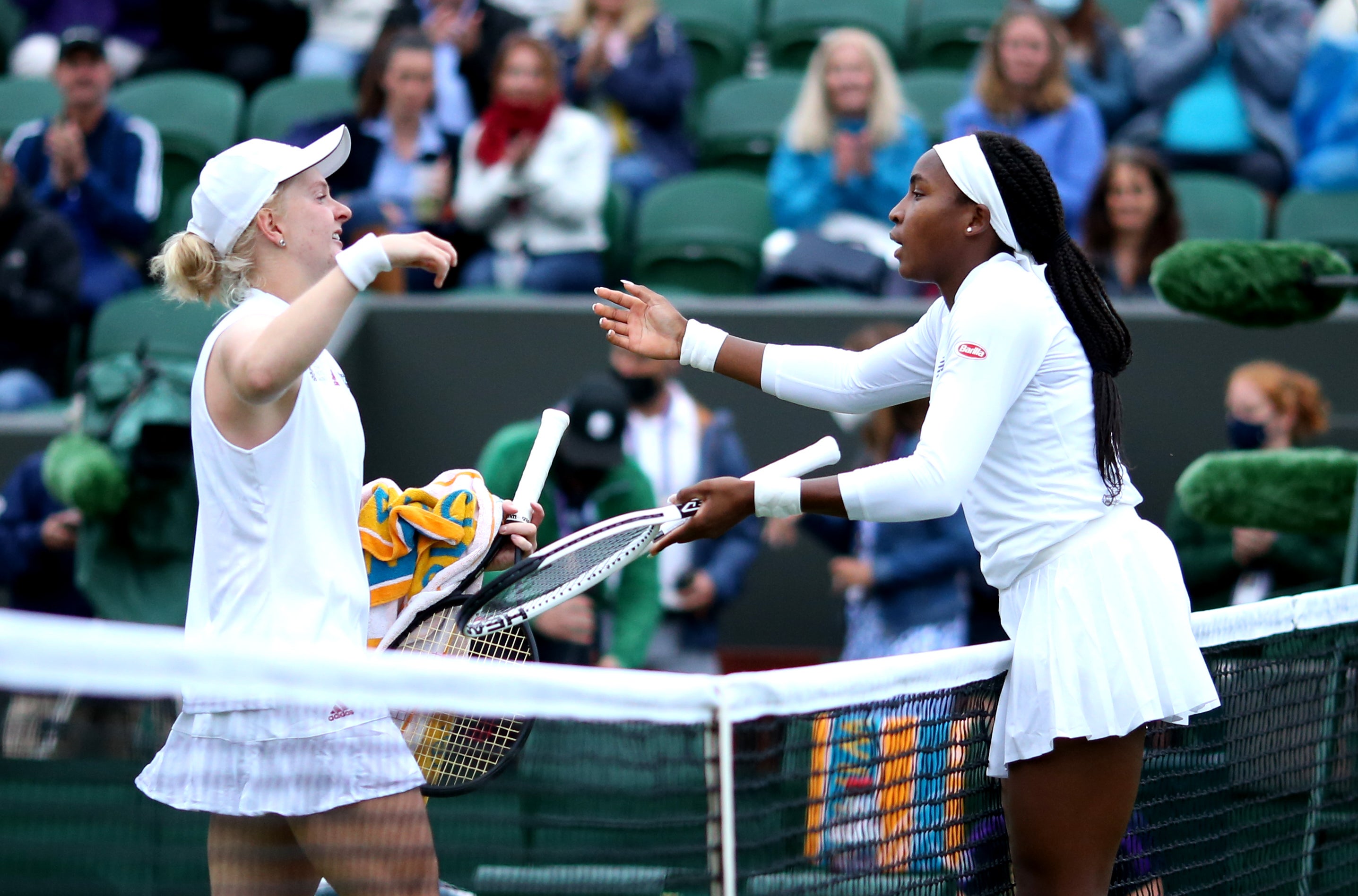 Coco Gauff hugs Francesca Jones after a hard-fought first round match on Wimbledon's Court Two.