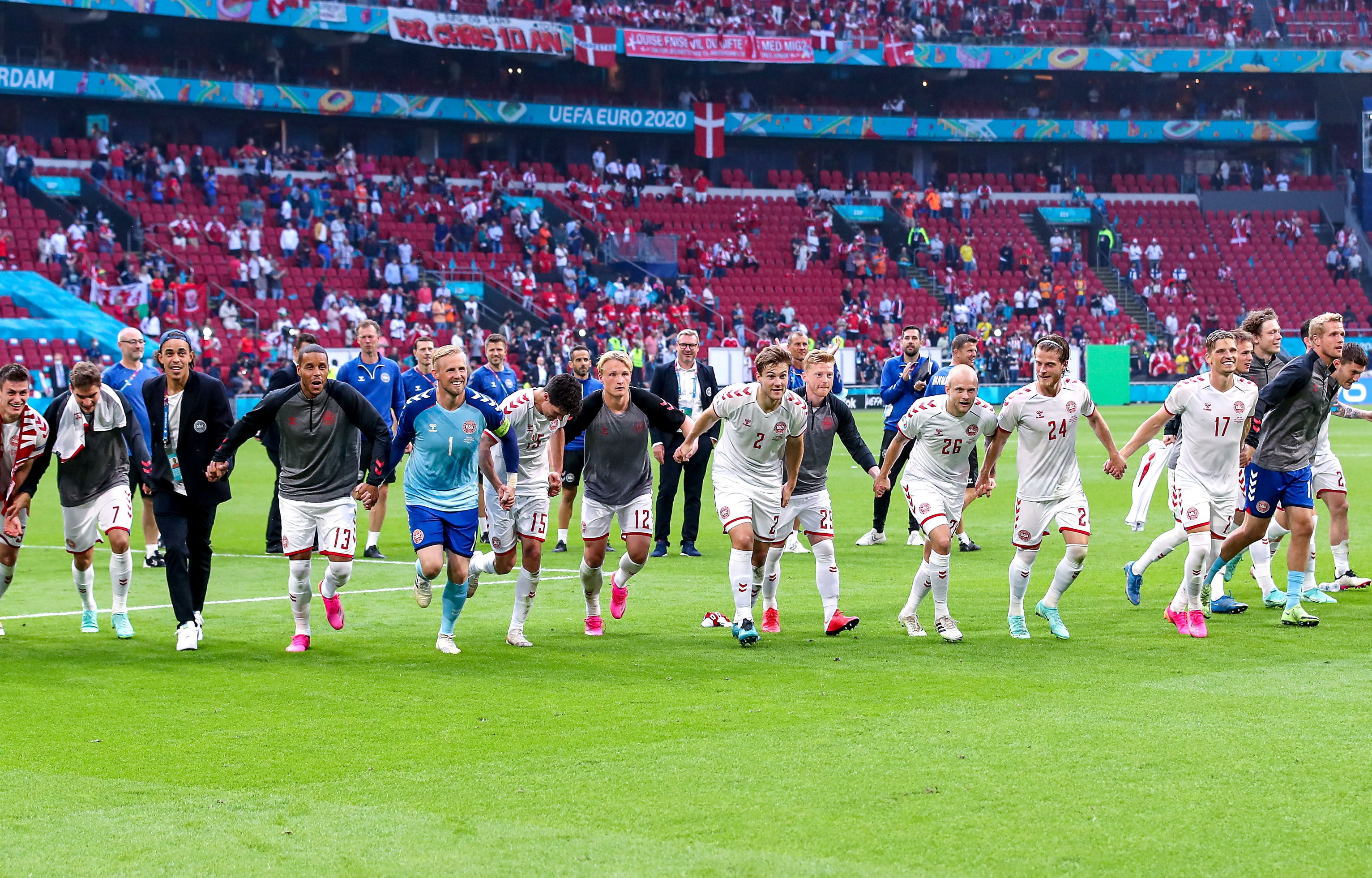 Denmark players celebrate victory after the final whistle at Euro 2020 against Wales in Amsterdam