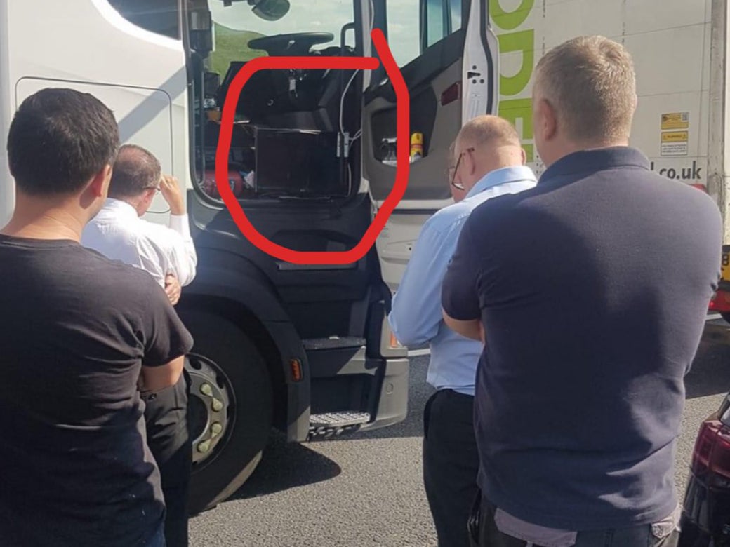 A group of motorists watch the England v Germany game on the M62 on 29 June, 2021