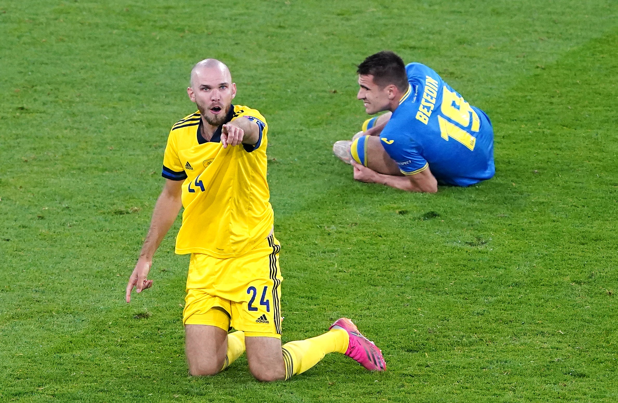 Ukraine's Artem Besedin (right) in the aftermath of Marcus Danielson's (left) red card challenge on him