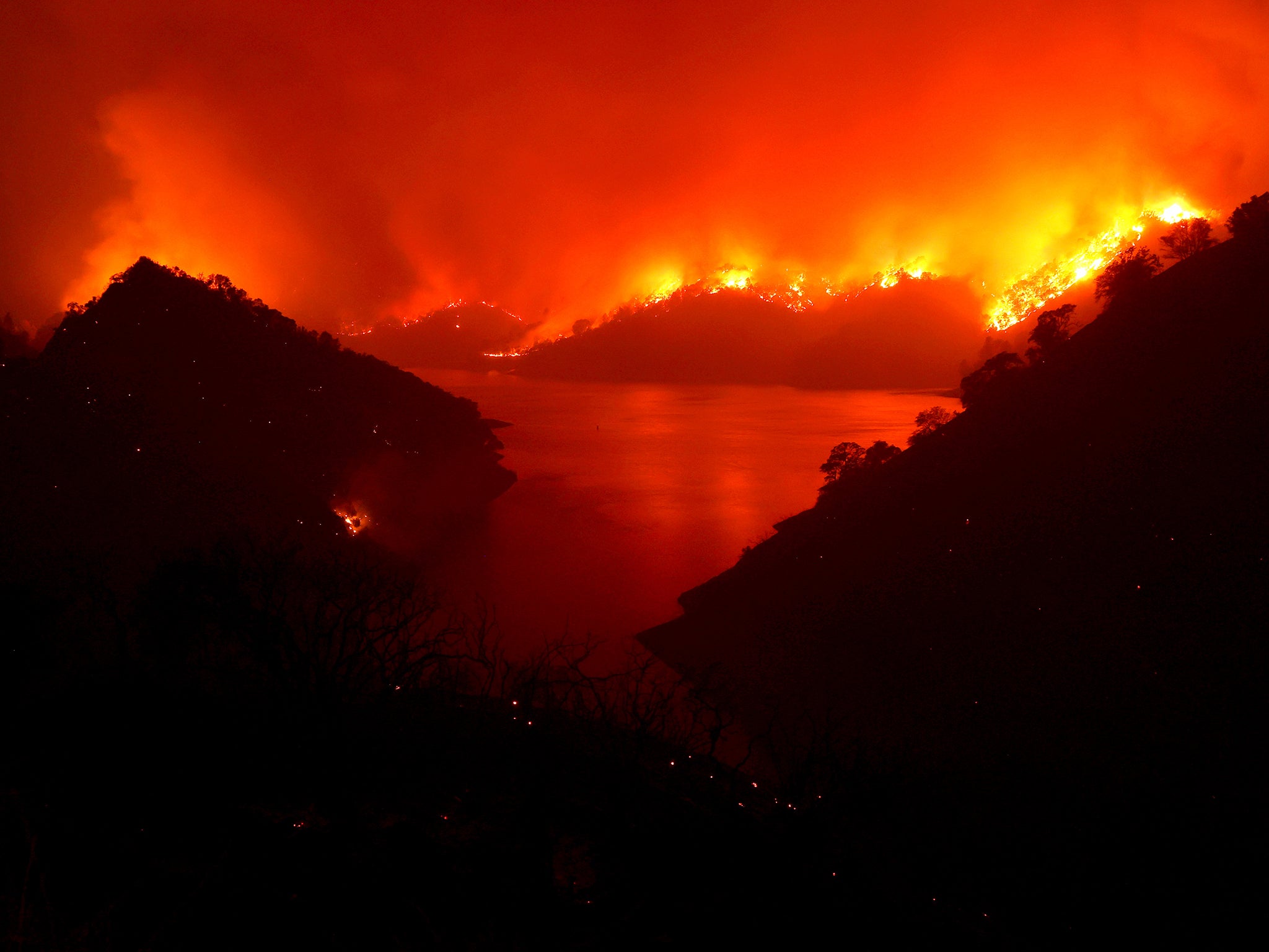 Flames surround Lake Berryessa from the Markley fire, which became part of the Lightning Complex