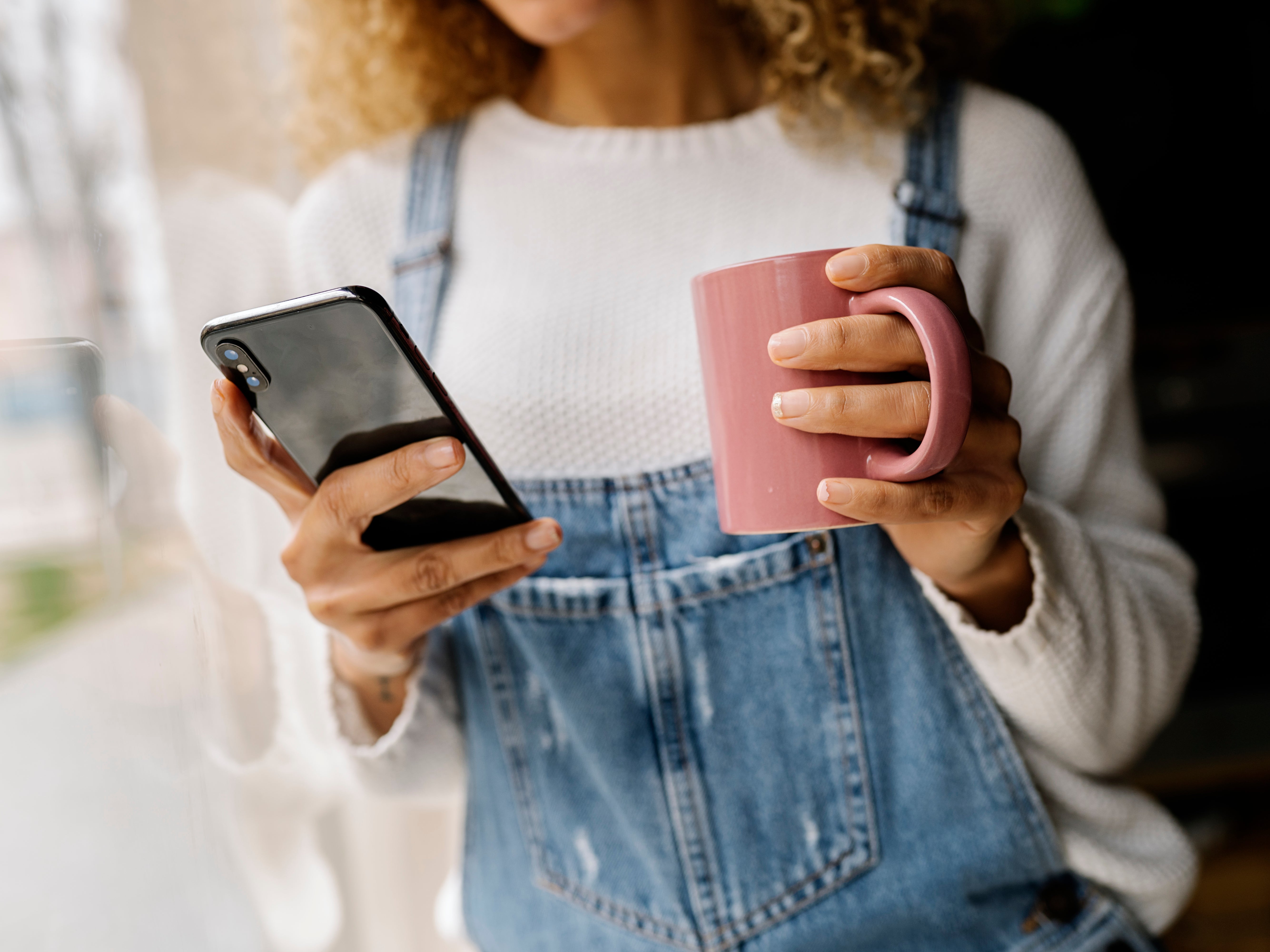 Woman looks at her phone