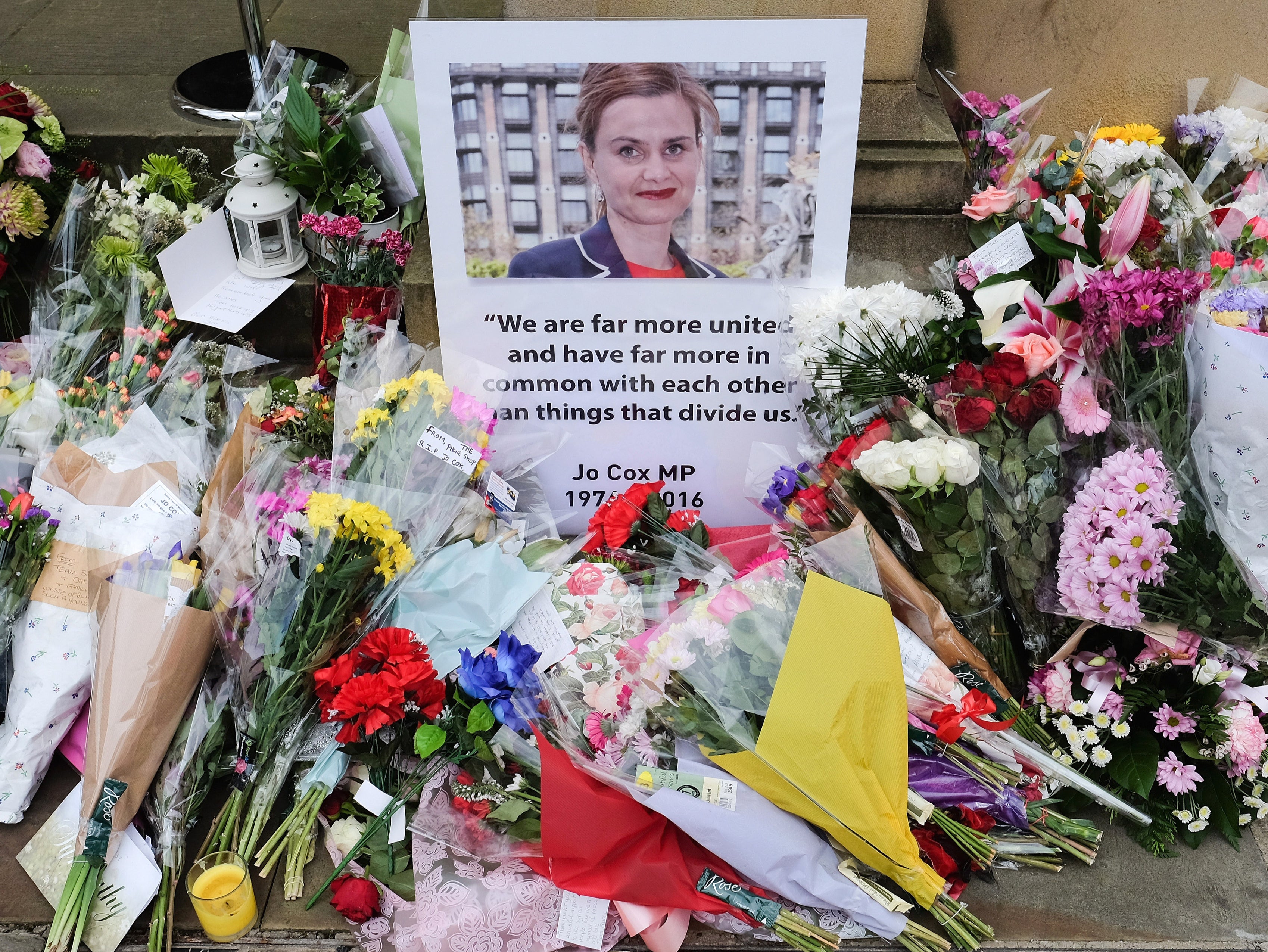 Floral tributes and messages are left outside Batley Town Hall ahead of a public event to celebrate the life of Labour MP Jo Cox on June 22, 2016