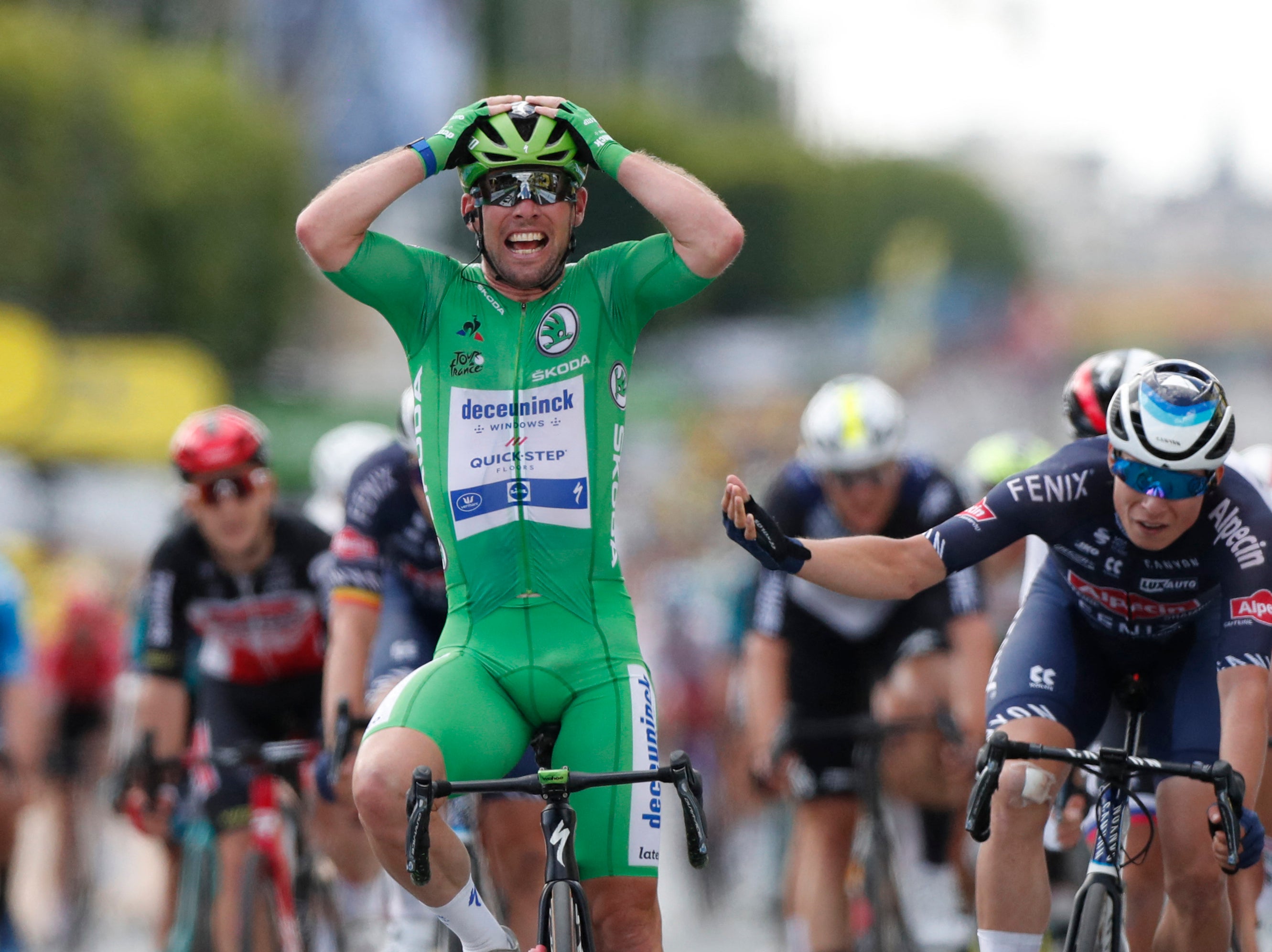 Mark Cavendish after crossing the line at the end of stage six