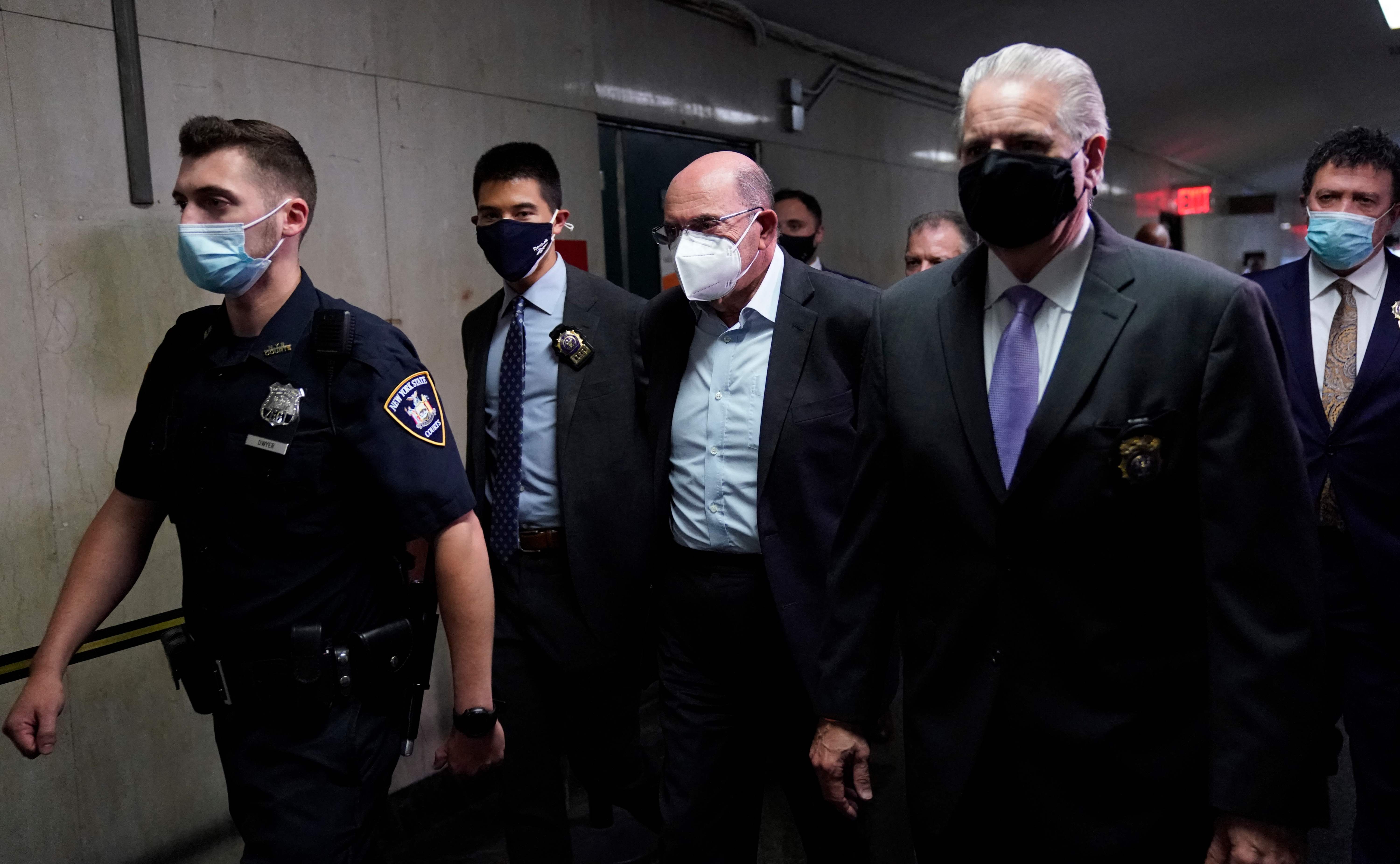 Allen Weisselberg (C) former US President Donald Trumps company chief financial officer arrives to attend the hearing