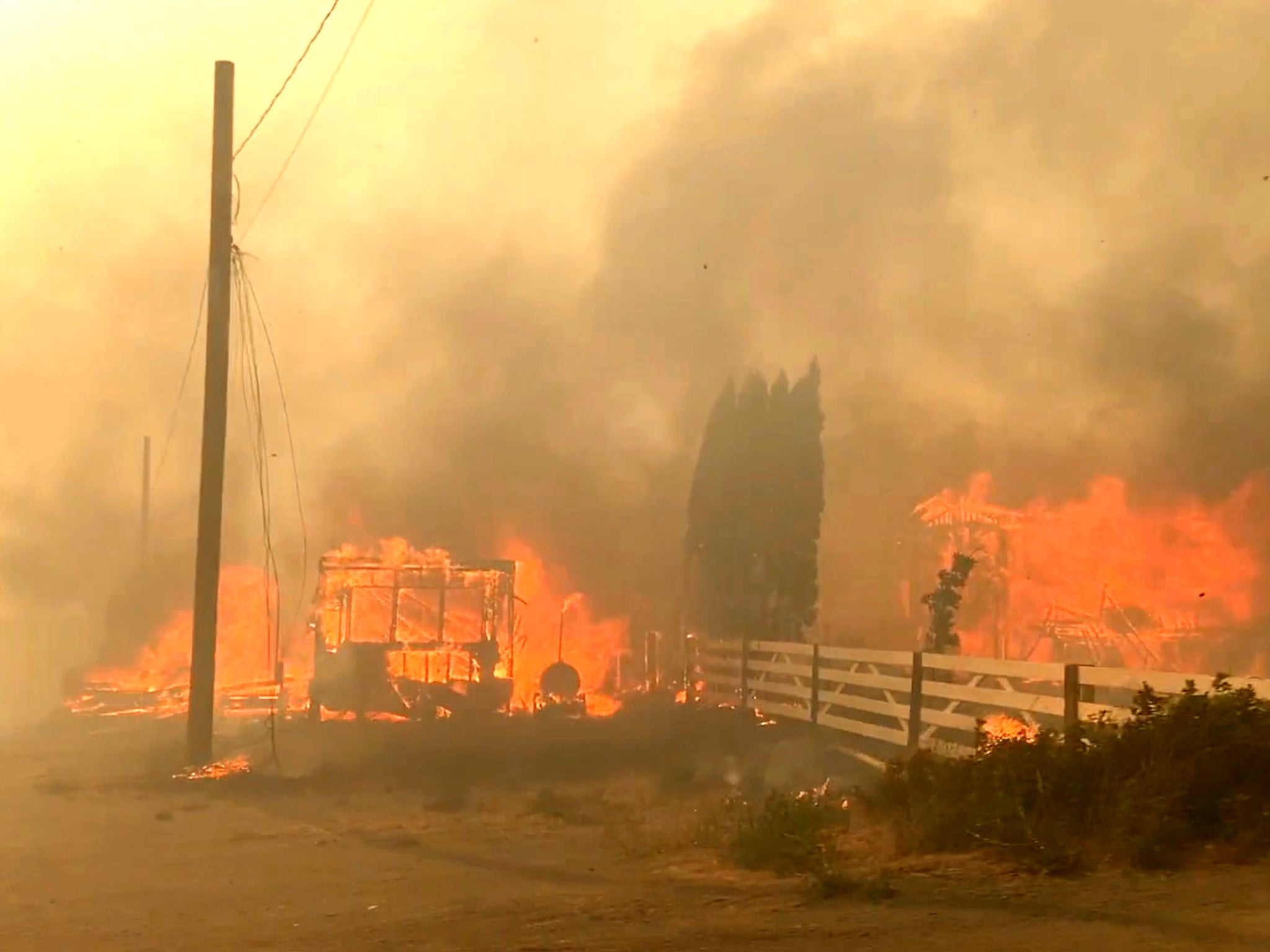 A building burning during a wildfire in Lytton, British Columbia, on 30 June