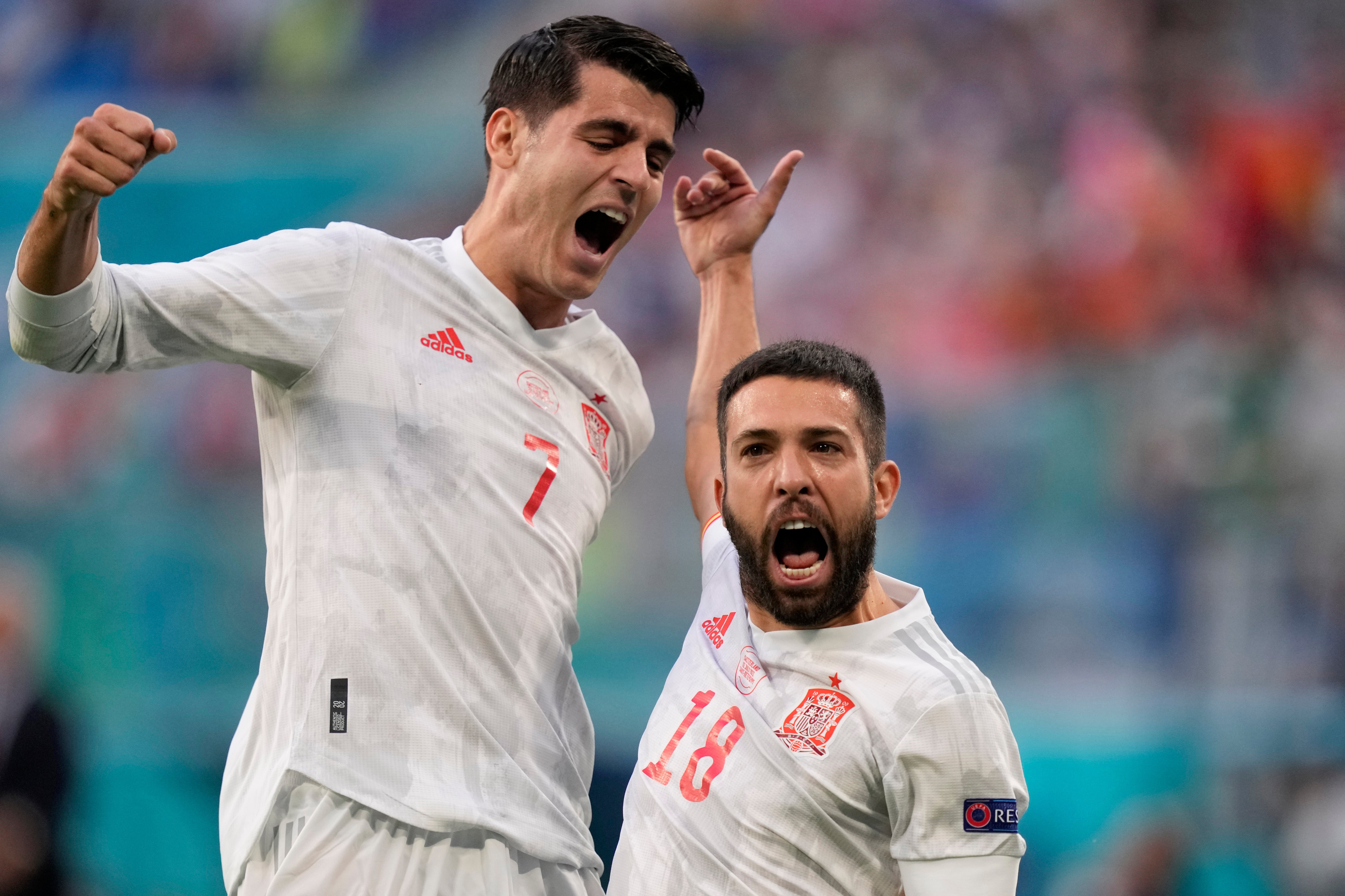 Spain's Alvaro Morata, left, and Jordi Alba celebrate after taking the lead against Switzerland