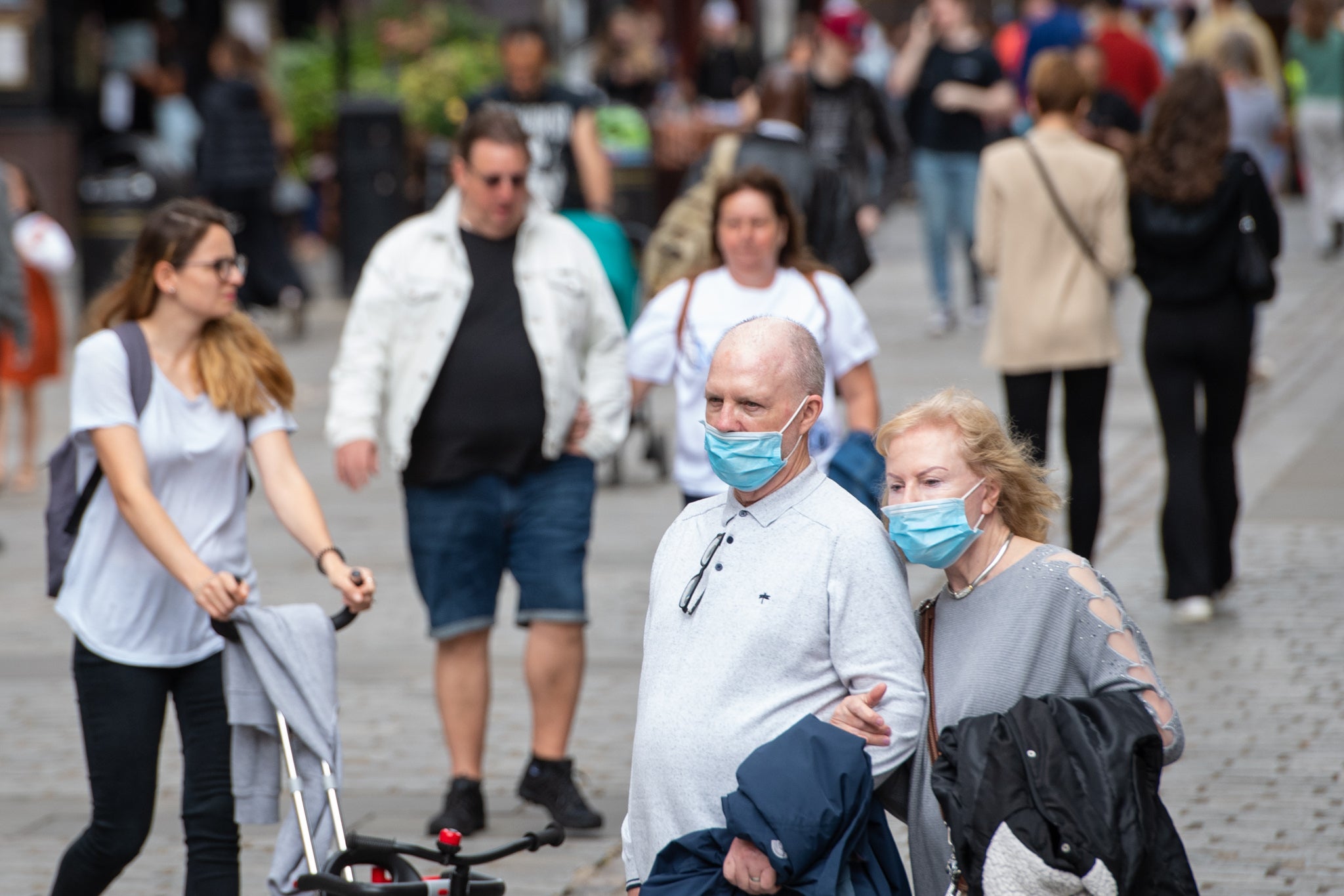 People wearing masks in a crowd