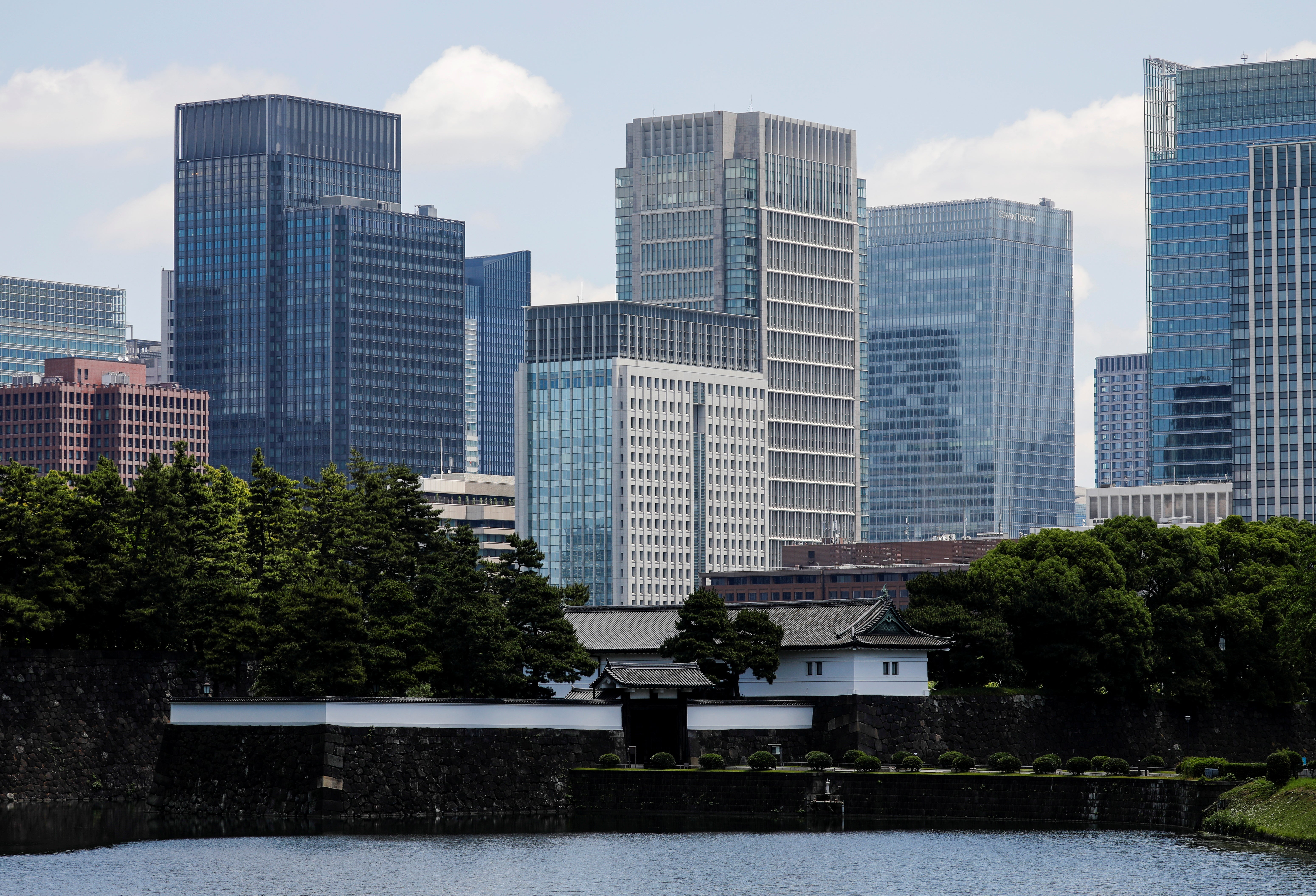 Sakuradamon Gate of the Imperial Palace stands in front of high-rise buildings in the Marunouchi business district in Tokyo