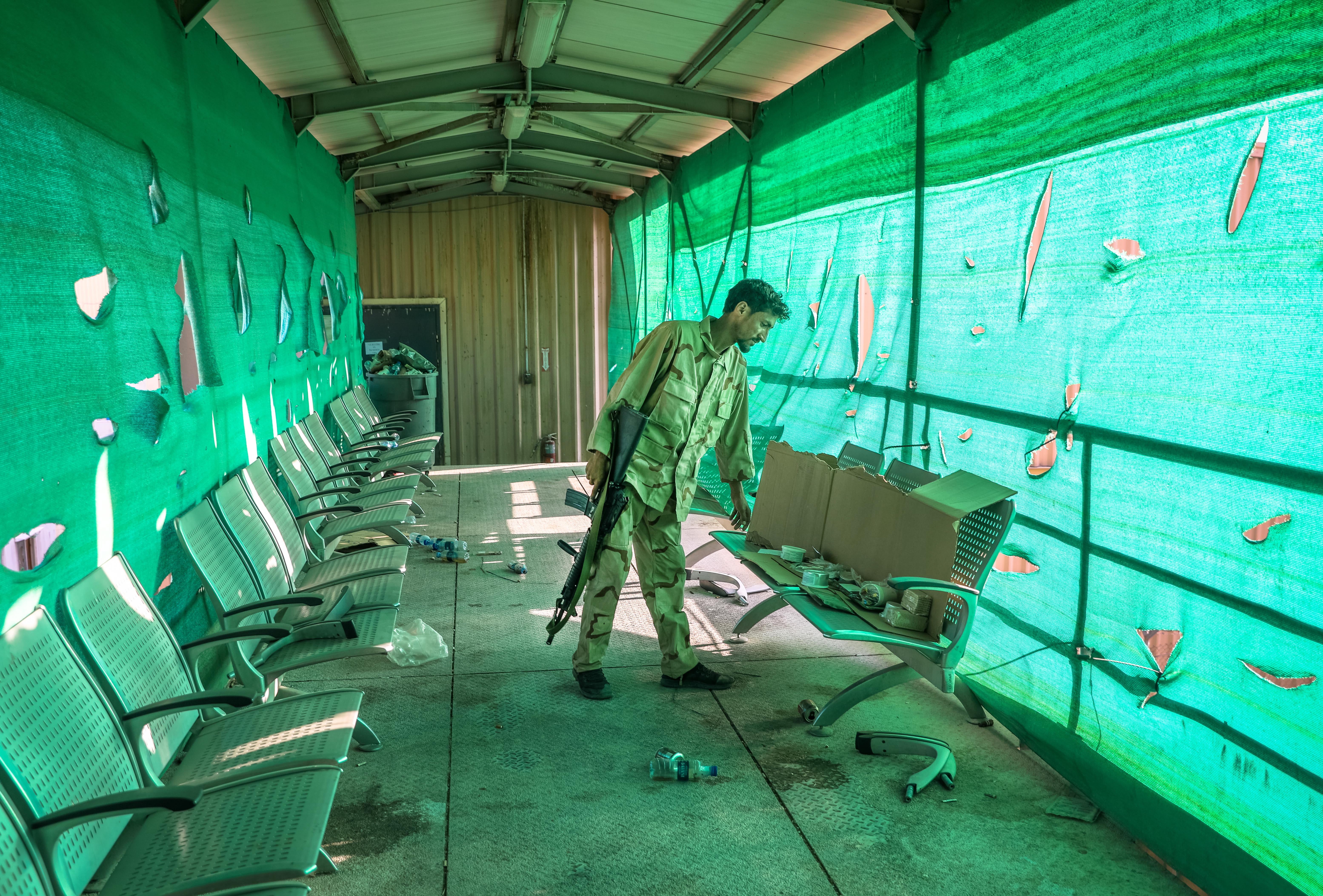 An Afghan army soldier surveys belongings left by the US military inside the Bagram Air Base, some 50 kilometers north of the capital Kabul, Afghanistan, 05 July 2021.