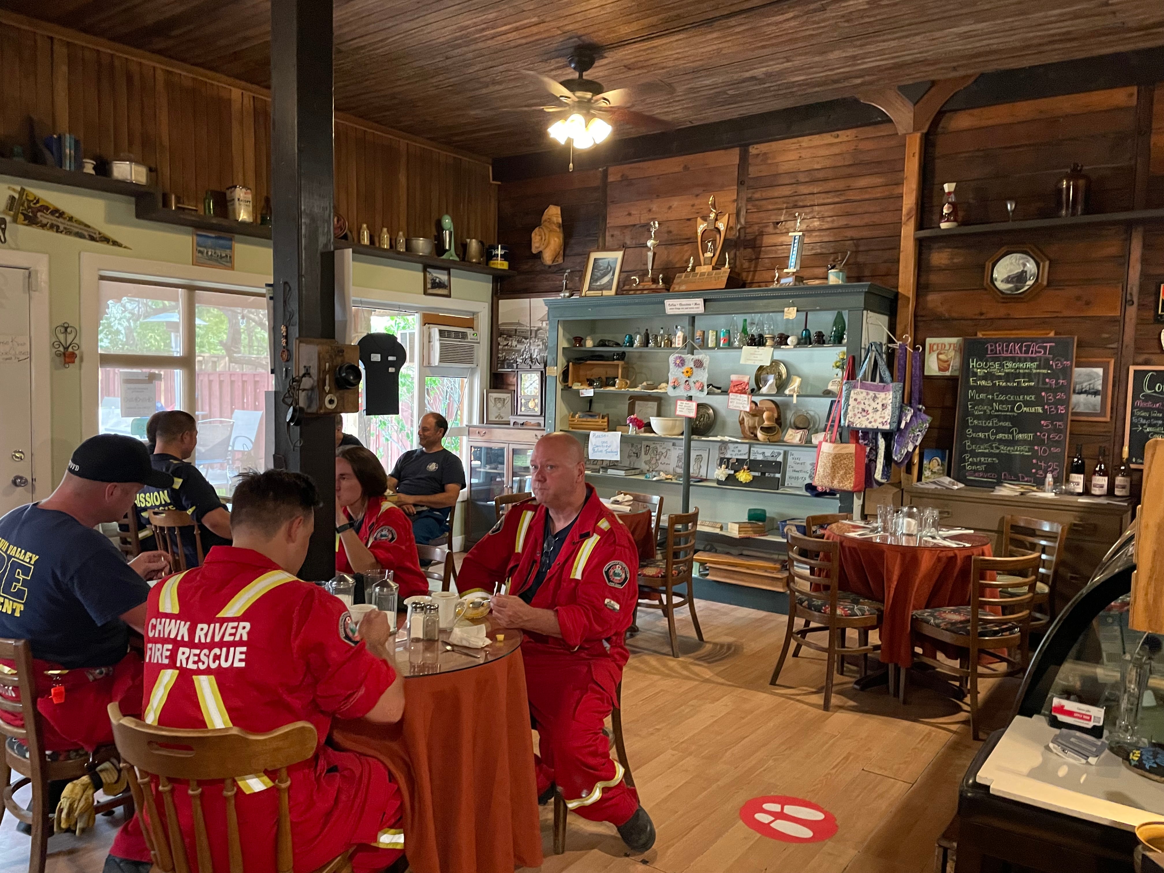 Emergency responders enjoy a meal at The Packing House, which closed to the public in order to feed those responding to the climate emergency.