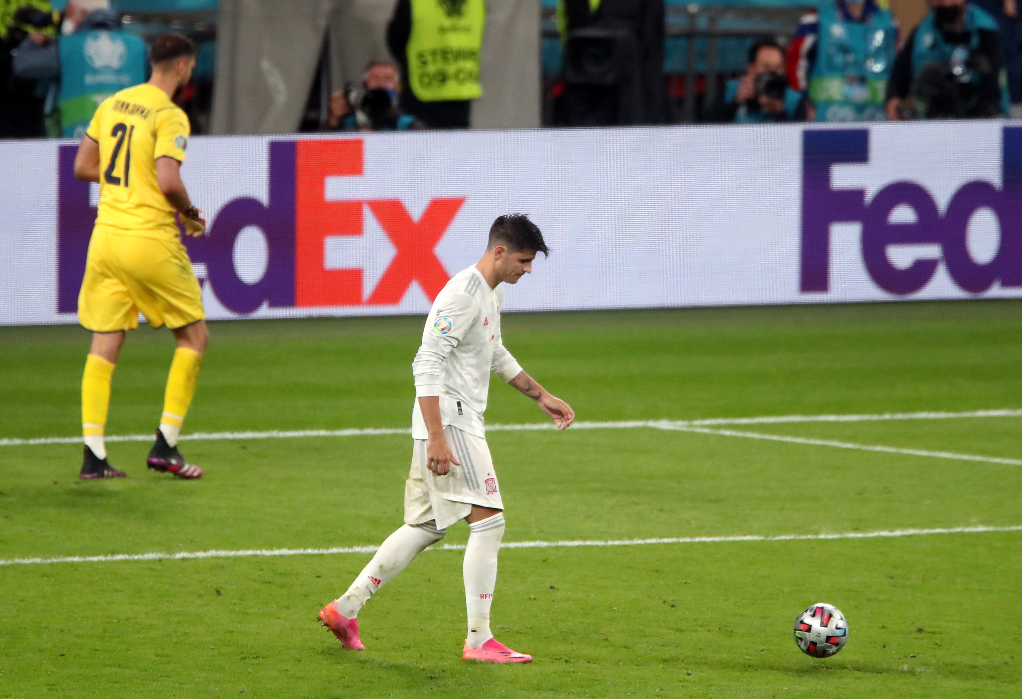 Alvaro Morata, right, reacts after his penalty was saved