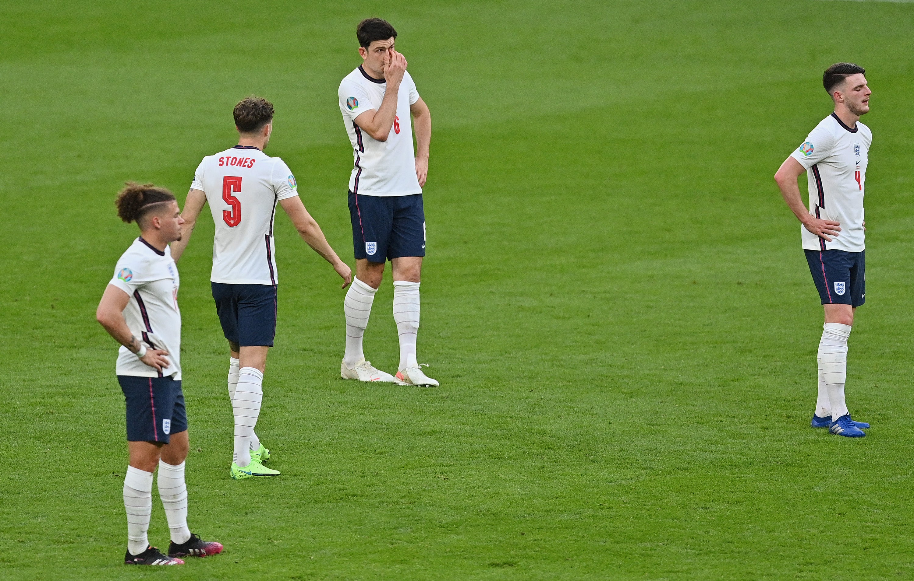 Kalvin Phillips, John Stones, Harry Maguire and Declan Rice of England look dejected after conceding