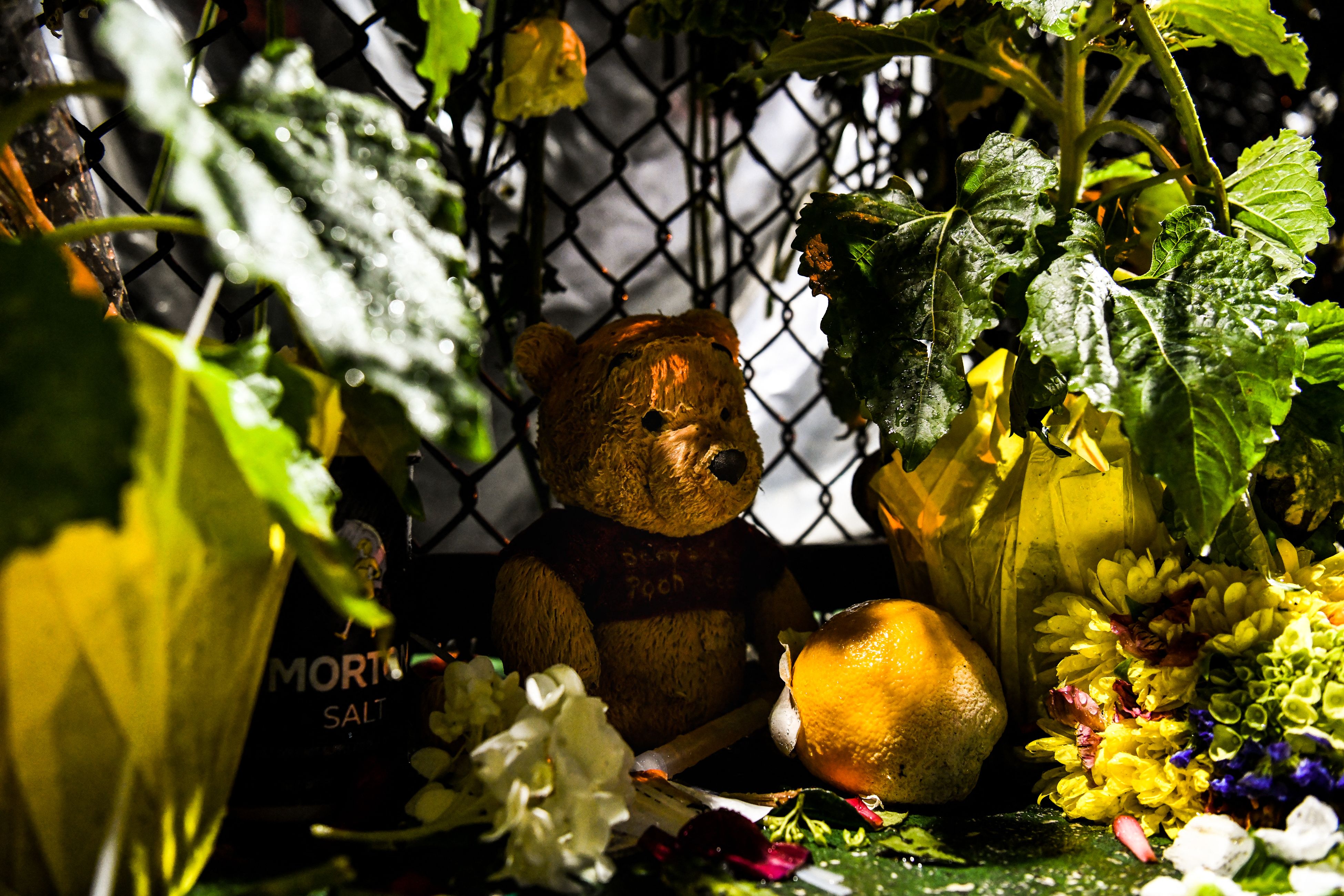 Toys found in the rubble are left by rescue workers at the makeshift memorial for the victims of the building collapse near the crash site in Surfside, Florida, north of Miami Beach on June 30, 2021. - Four more bodies were discovered overnight in the rubble of a collapsed apartment building in Florida, authorities said Wednesday, as the search for more than 140 people unaccounted for entered its seventh day. The official death toll now stands at 16 after most of a building in the Miami-area town of Surfside suddenly pancaked early last Thursday, but hopes are dwindling that the hundreds of rescuers combing the oceanfront site will find anyone alive.