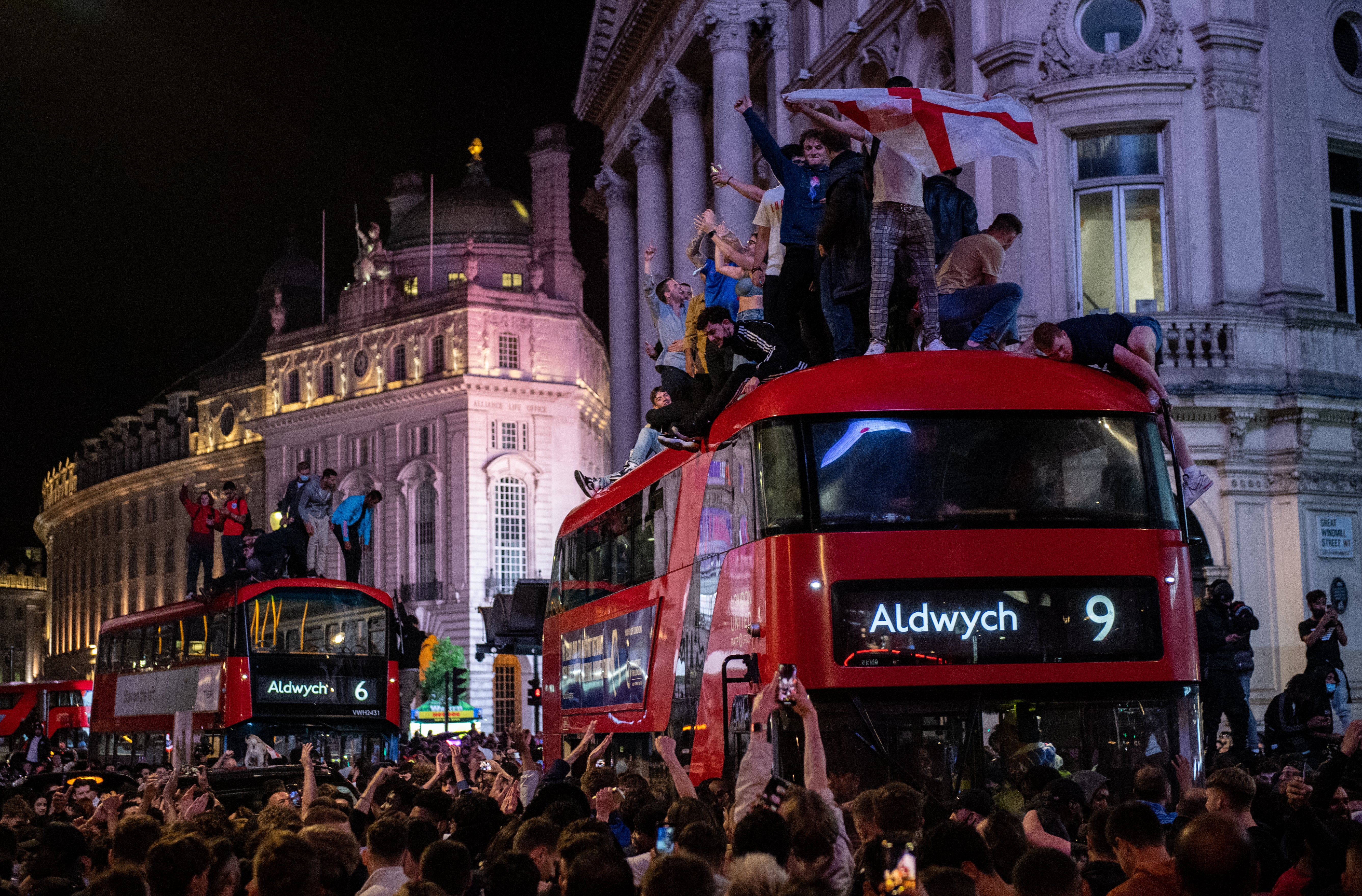 England football fans celebrate in the streets surrounding Piccadilly and Leicester Square