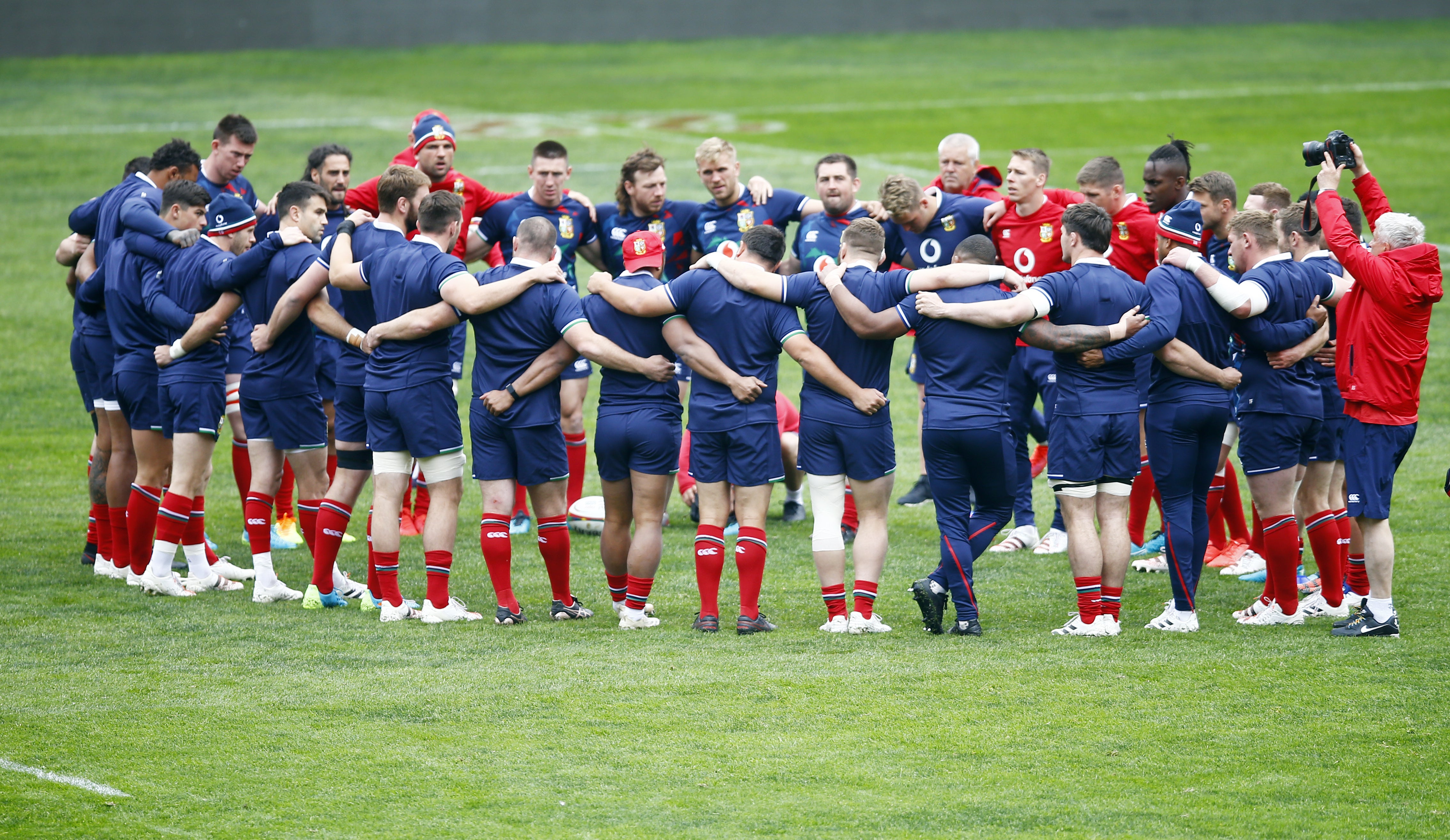 Lions players in a huddle