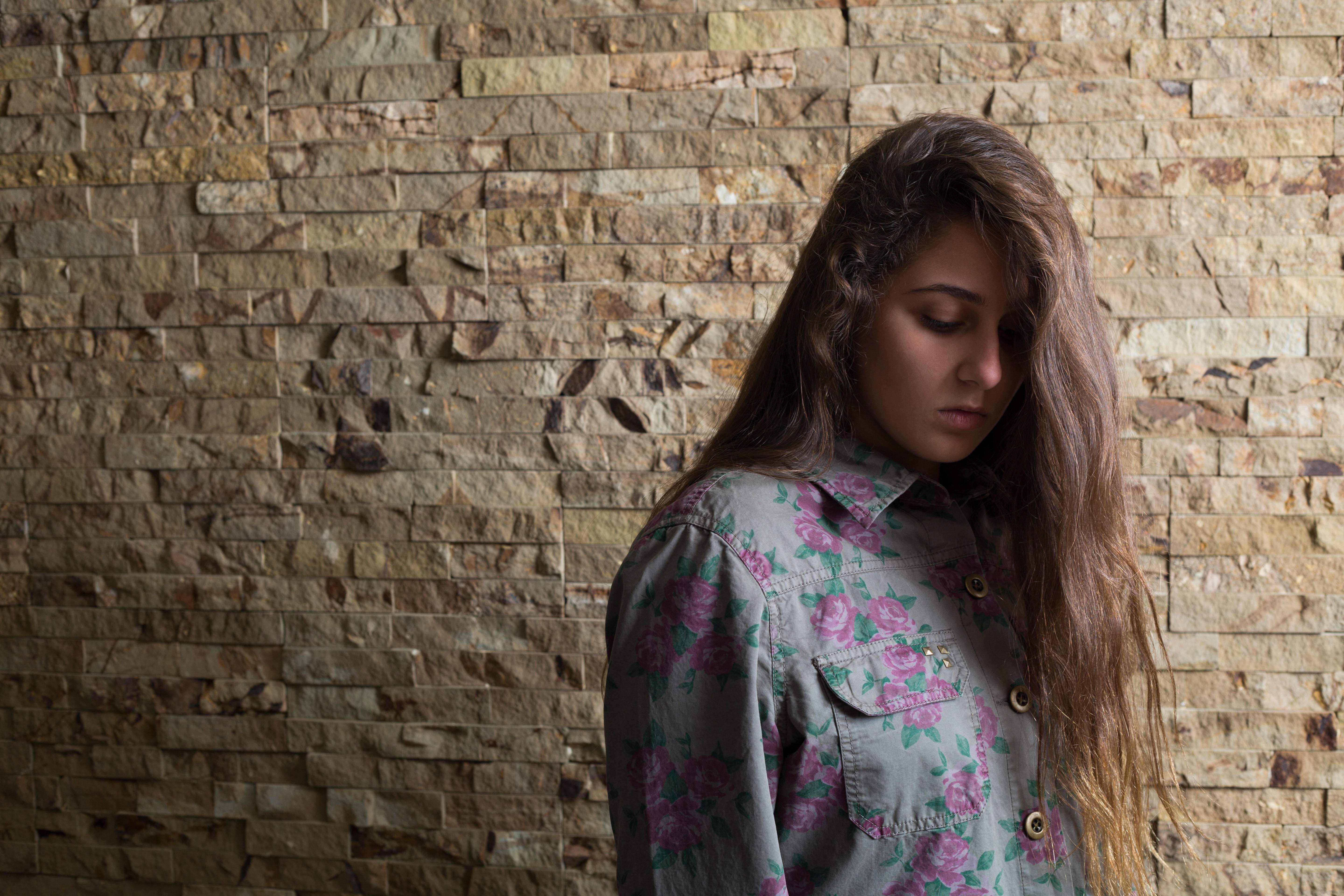 Sad teenage girl looking down