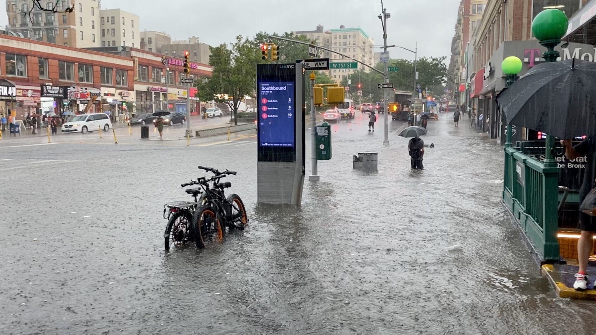 Storm Elsa: Passengers filmed wading through waist-high dirty water to get on New York subway after floods