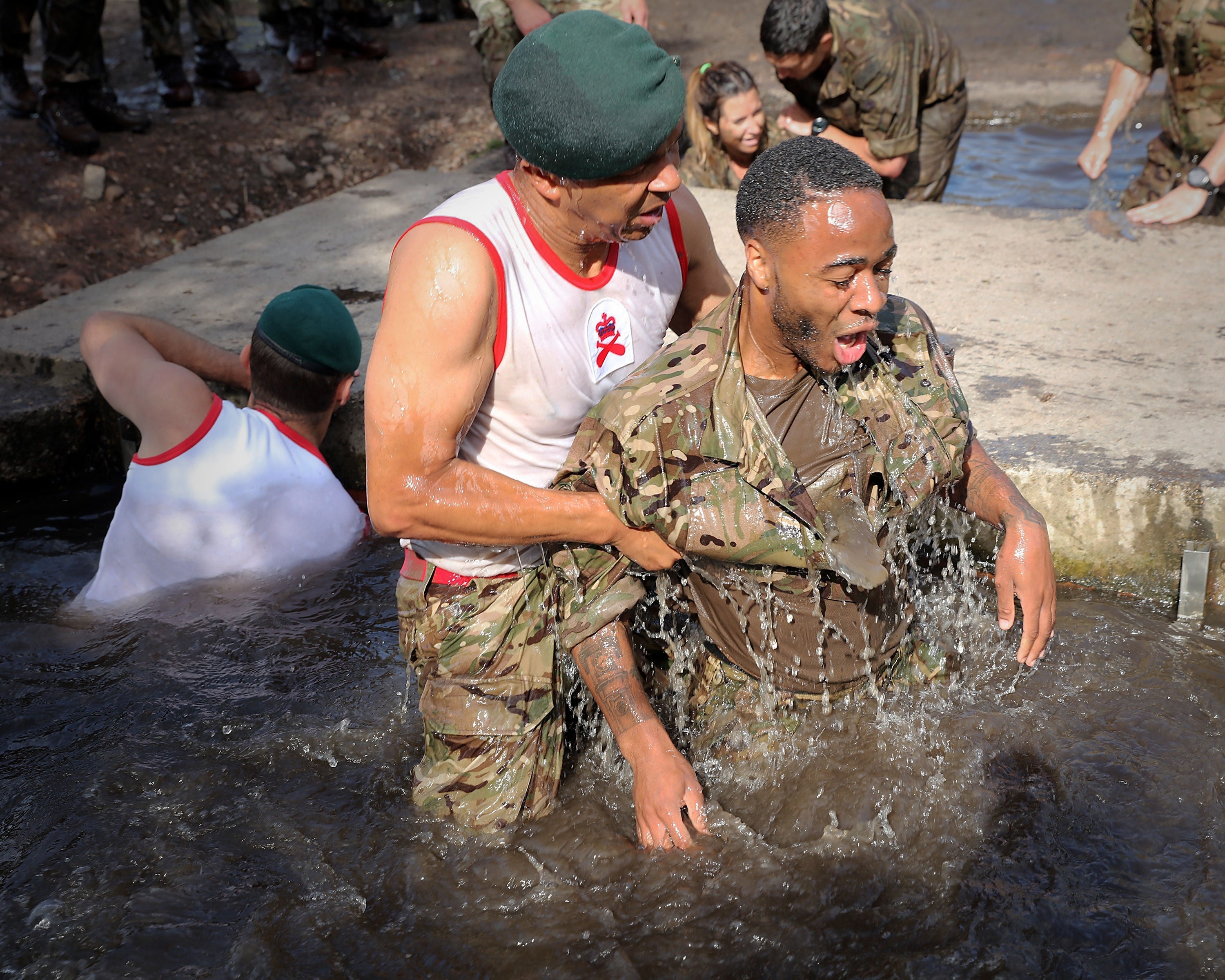 Raheem Sterling successfully completes the 'sheep dip' on the marines endurance course, a boot camp Southgate arranged for the squad in June 2017