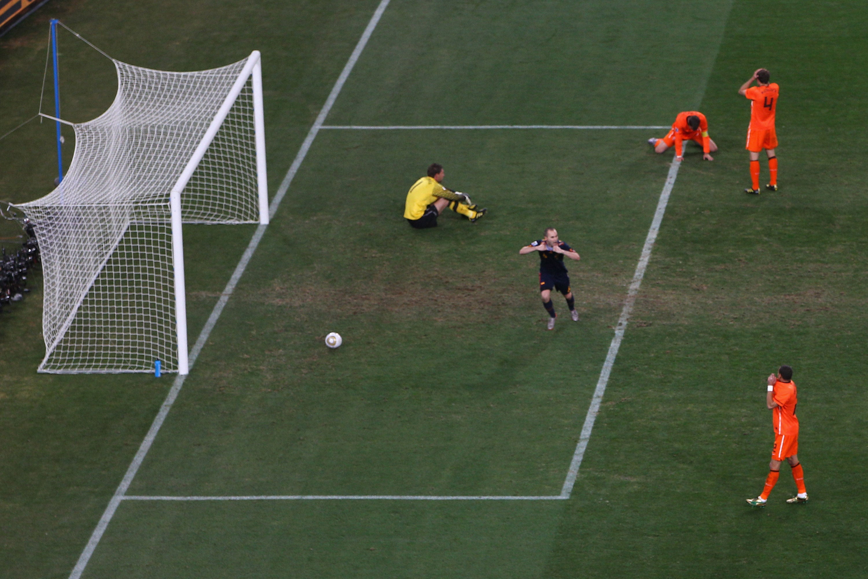 Iniesta celebrates scoring the winning goal of the 2010 World Cup final against Netherlands