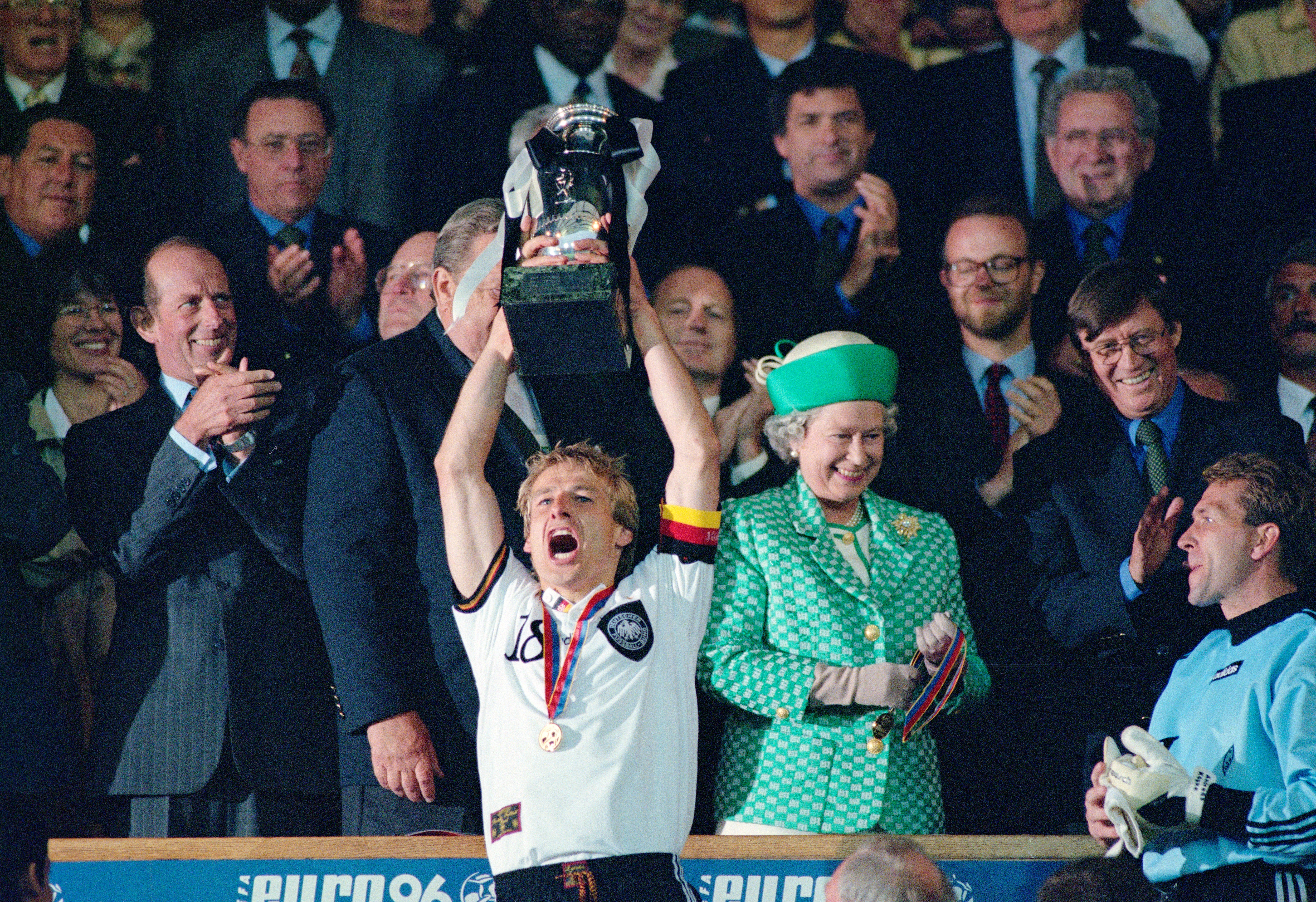 Jürgen Klinsmann lifts the trophy after winning the Euro 96 final at Wembley