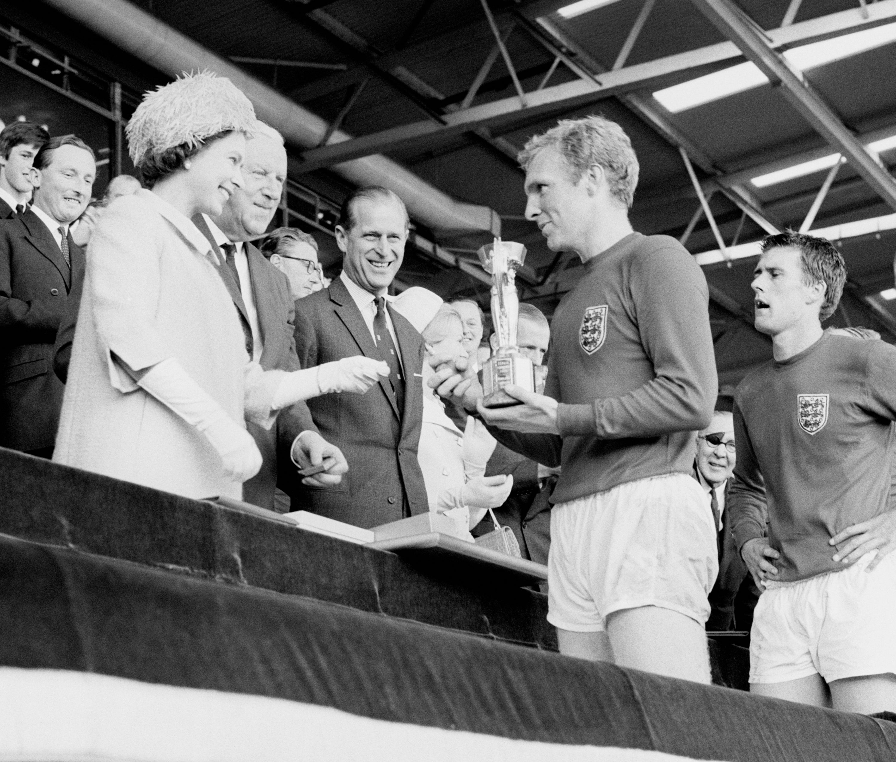 The Queen has recalled presenting England captain Sir Bobby Moore with the World Cup in 1966, as she wished the current team luck in the Euros final