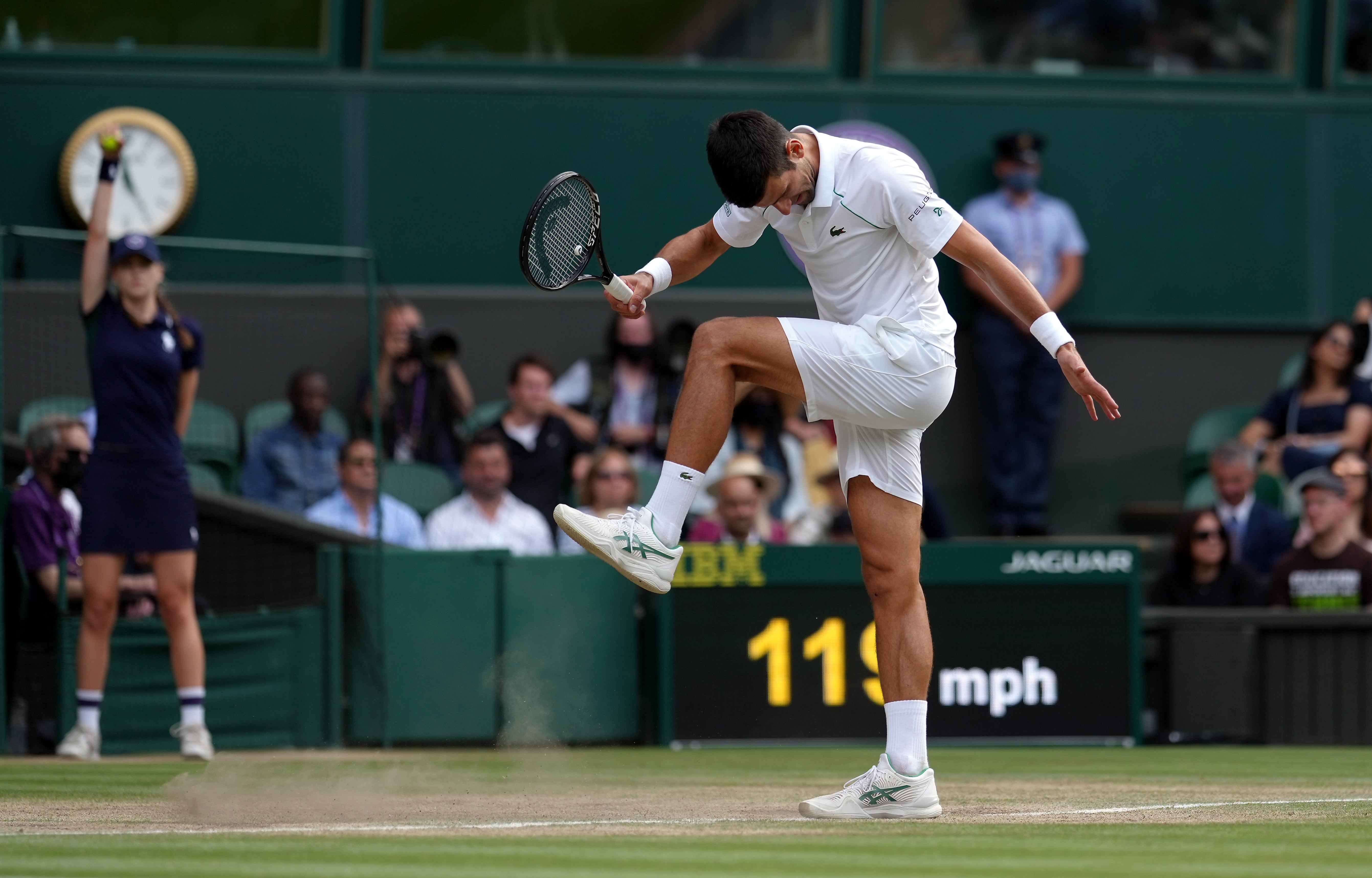 Novak Djokovic kicks the surface