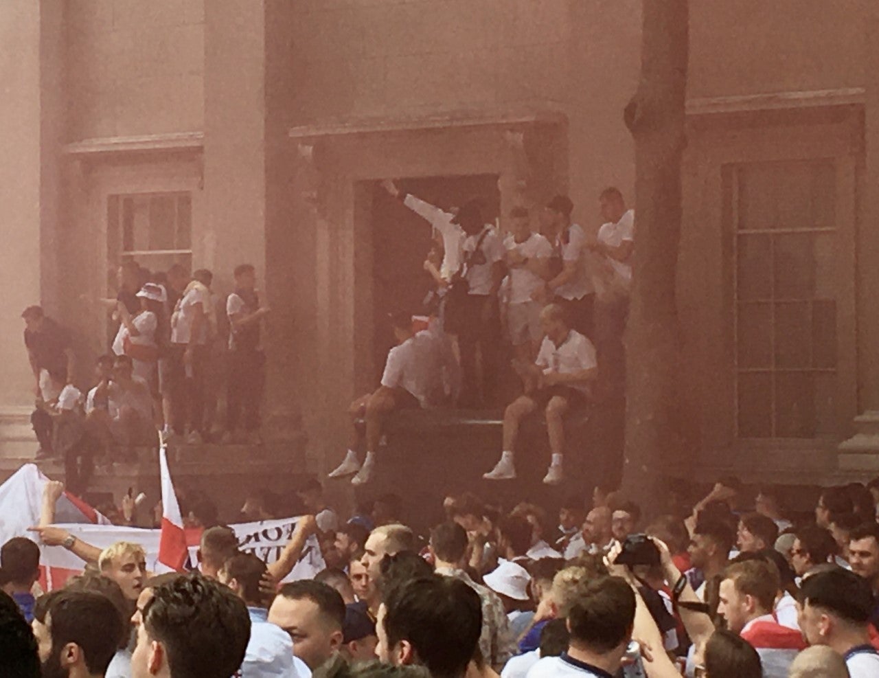 England fans let off flares in Leicester Square in central London ahead of the Euro 2020 final against Italy