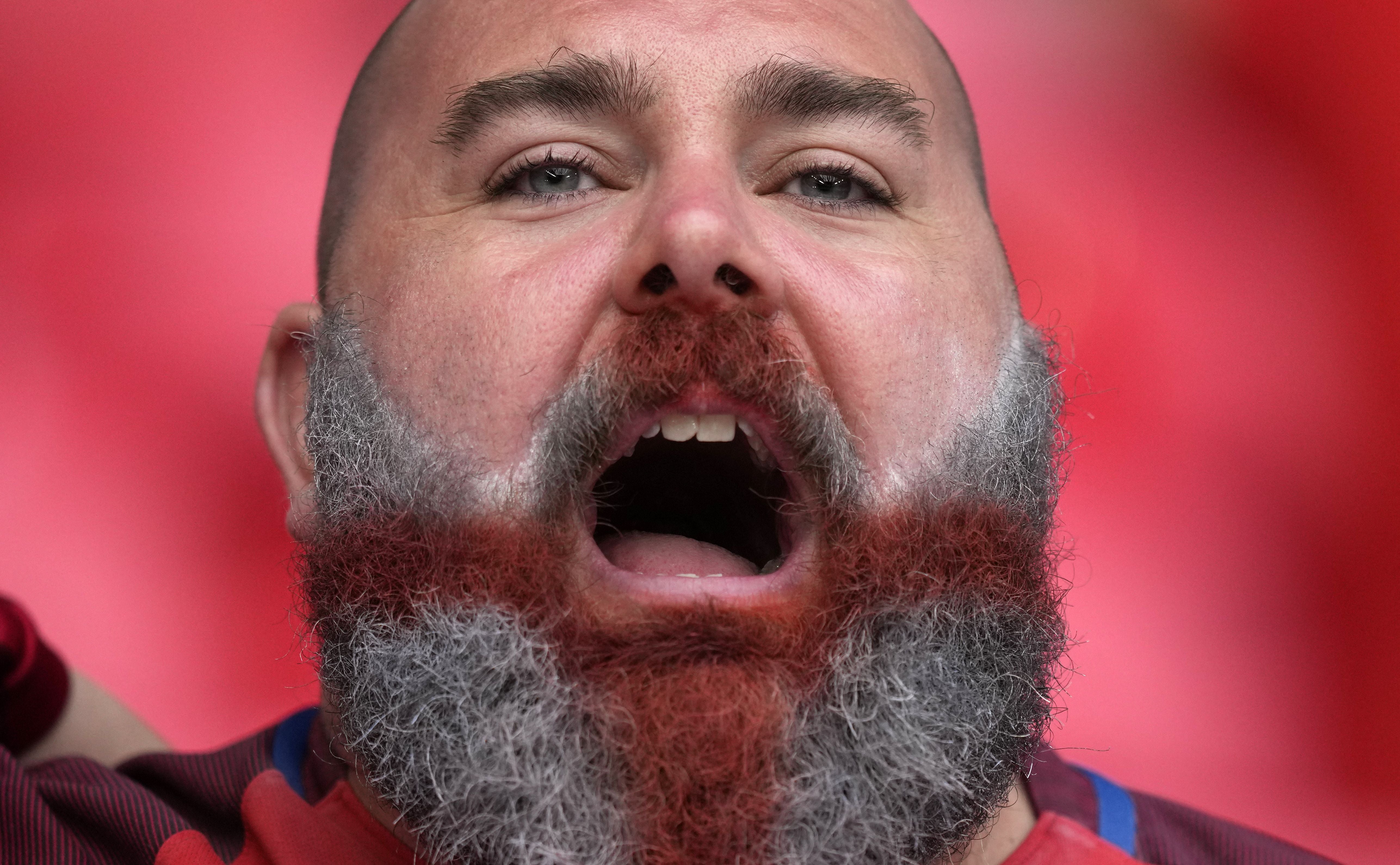 An England fan sings before the start of the UEFA EURO 2020 final football match between Italy and England at Wembley Stadium