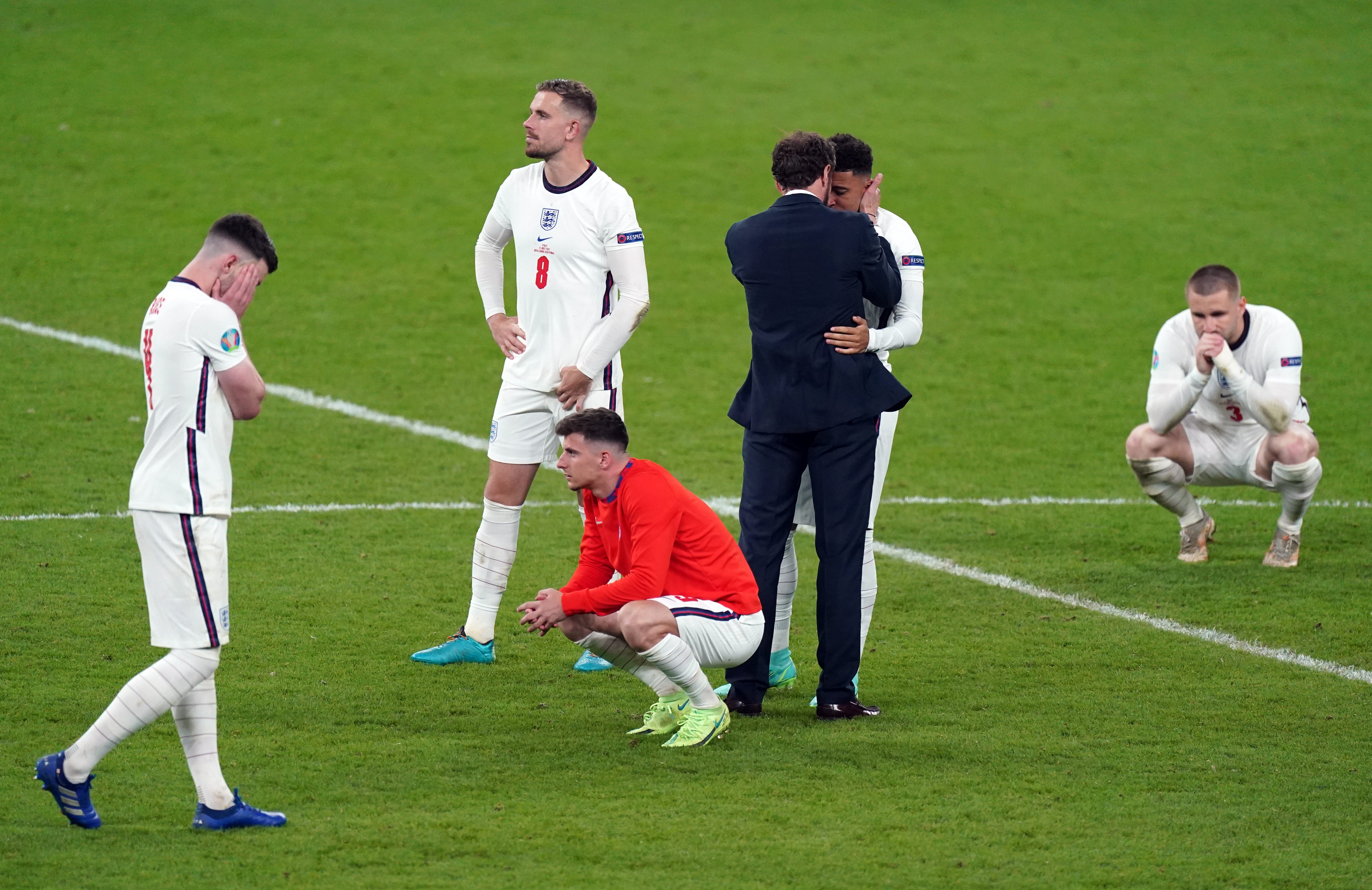 England manager Gareth Southgate consoles his players after the defeat