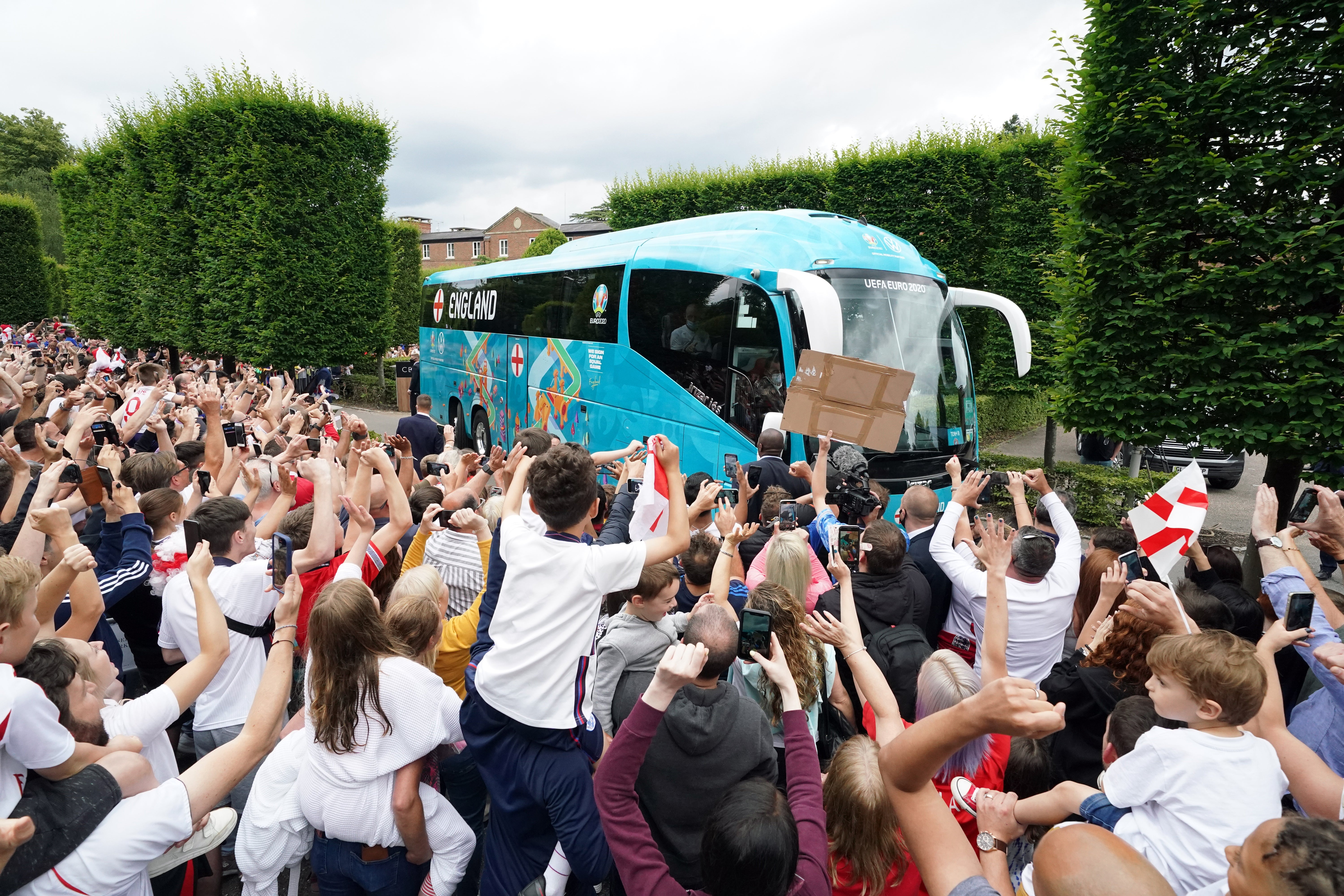 England fans cheer the bus leaving the hotel