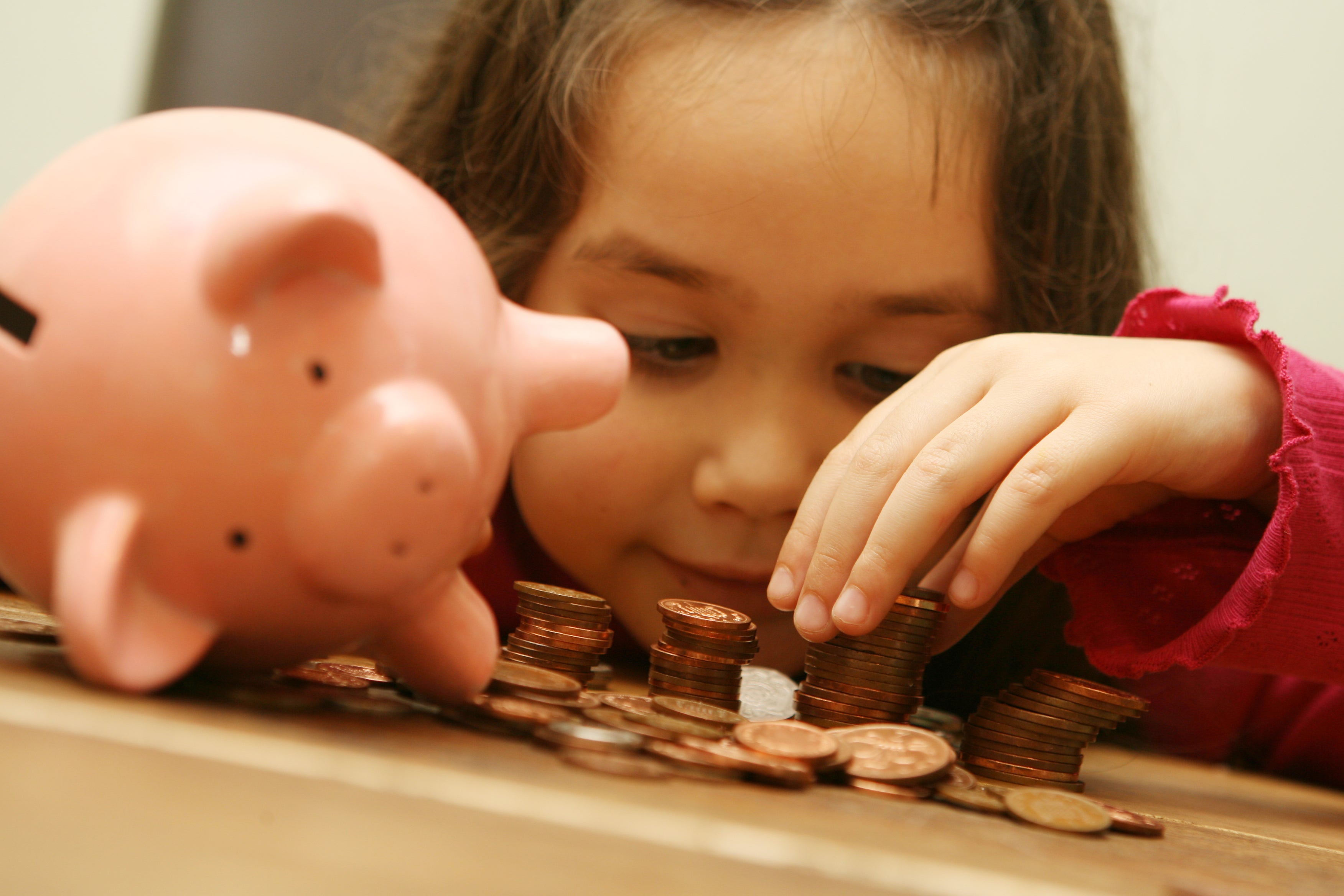 A child with a piggy bank