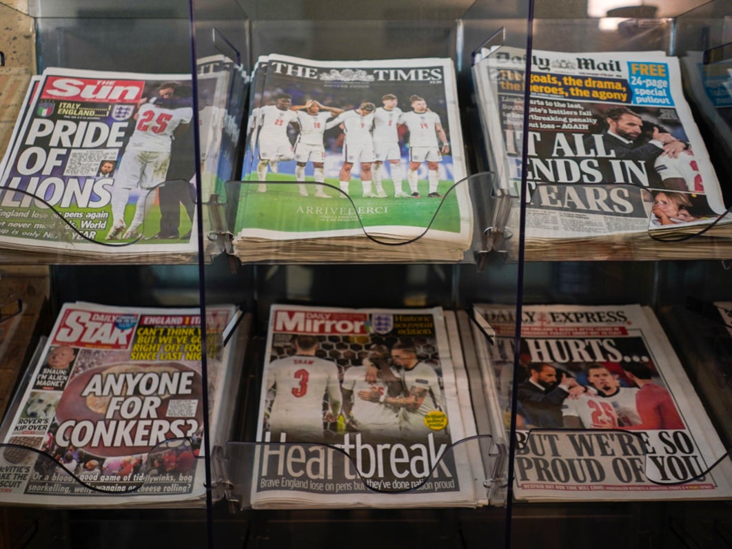 Front pages of British newspapers are displayed at a newsagent in London on Monday 12 July 2021 after Italy beat England to win Euro 2020 at Wembley