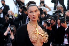 Bella Hadid wears giant golden lung necklace with couture dress at Cannes