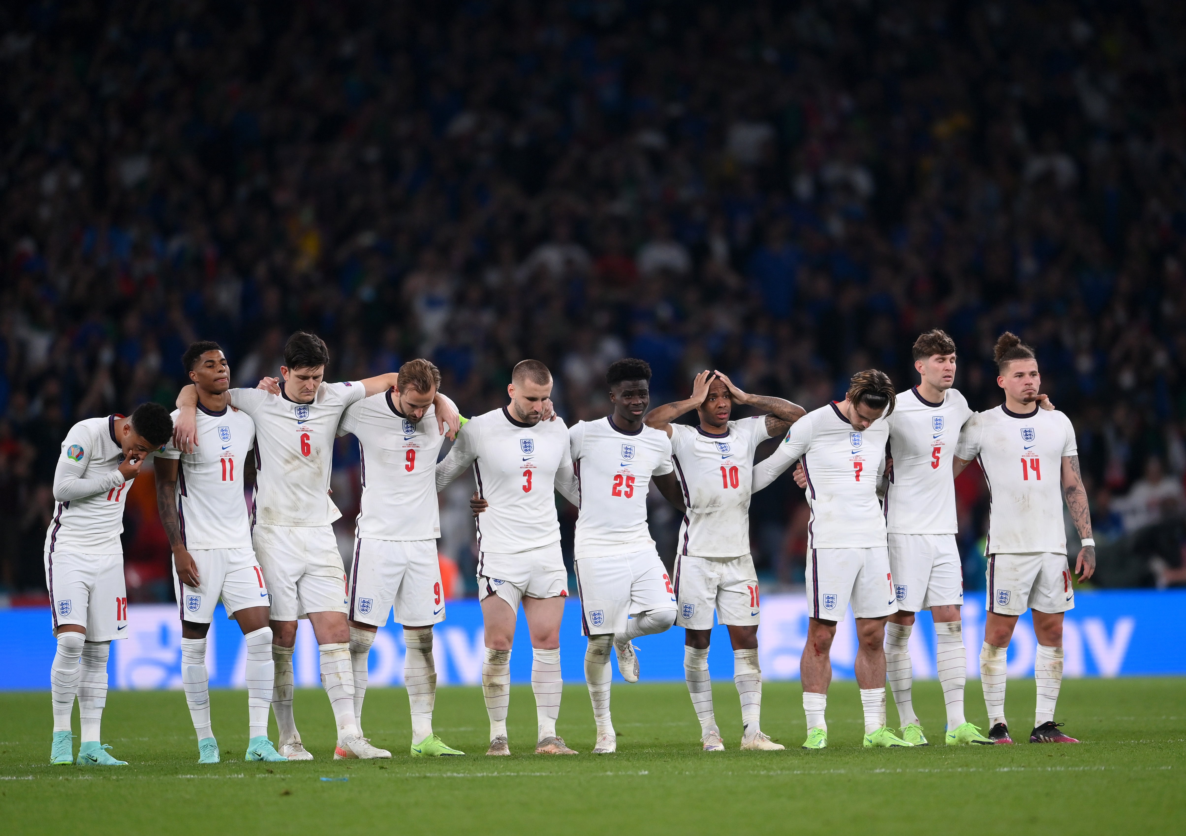 Jadon Sancho, Marcus Rashford, Harry Maguire, Harry Kane, Luke Shaw, Bukayo Saka, Raheem Sterling, Jack Grealish, John Stones and Kalvin Phillips look on during the penalty shoot out during the UEFA Euro 2020 Championship Final between Italy and England at Wembley Stadium on 11 July, 2021 in London, England.