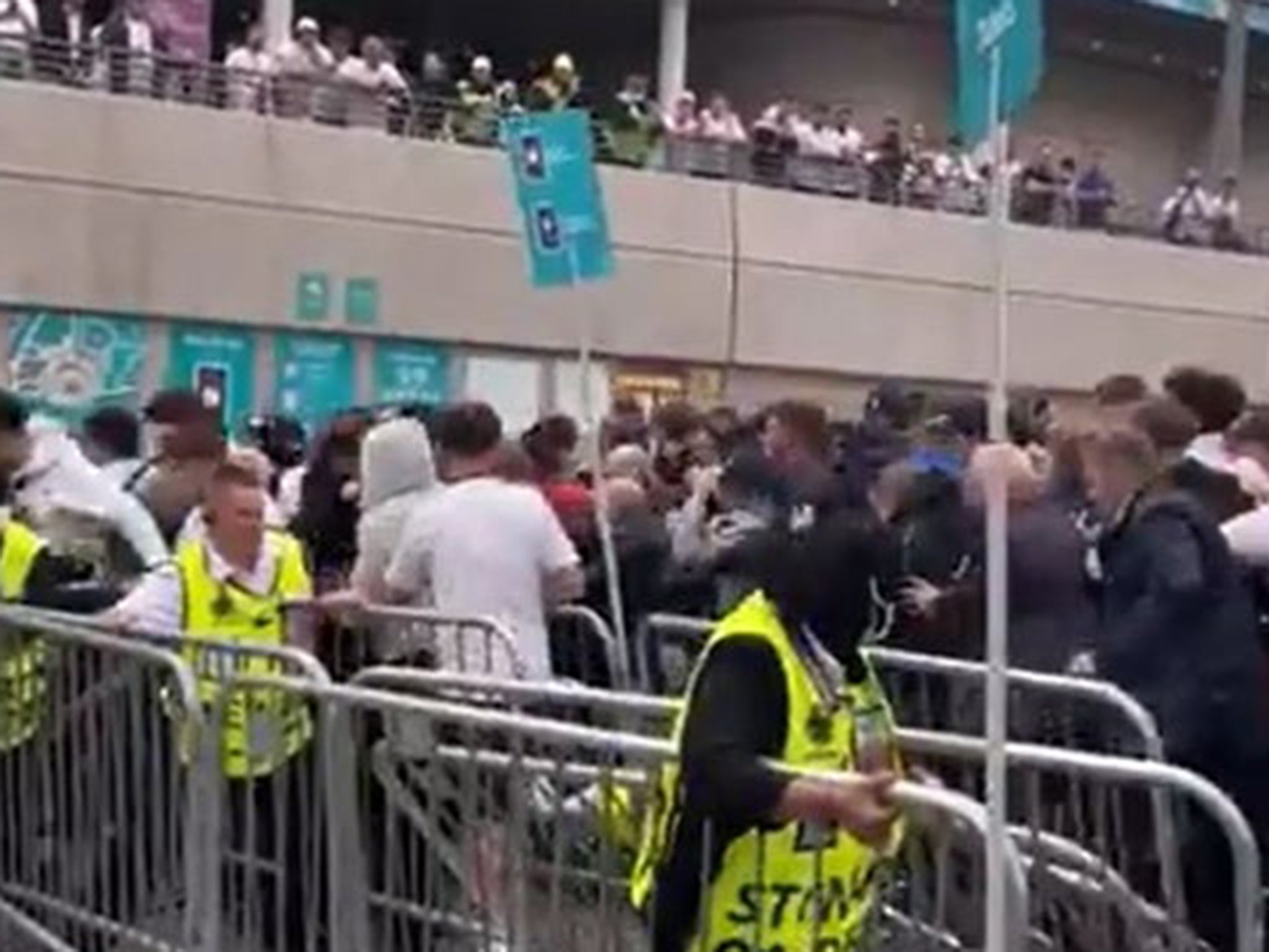 Fans rushed through barriers at Wembley stadium before the Euro 2020 final