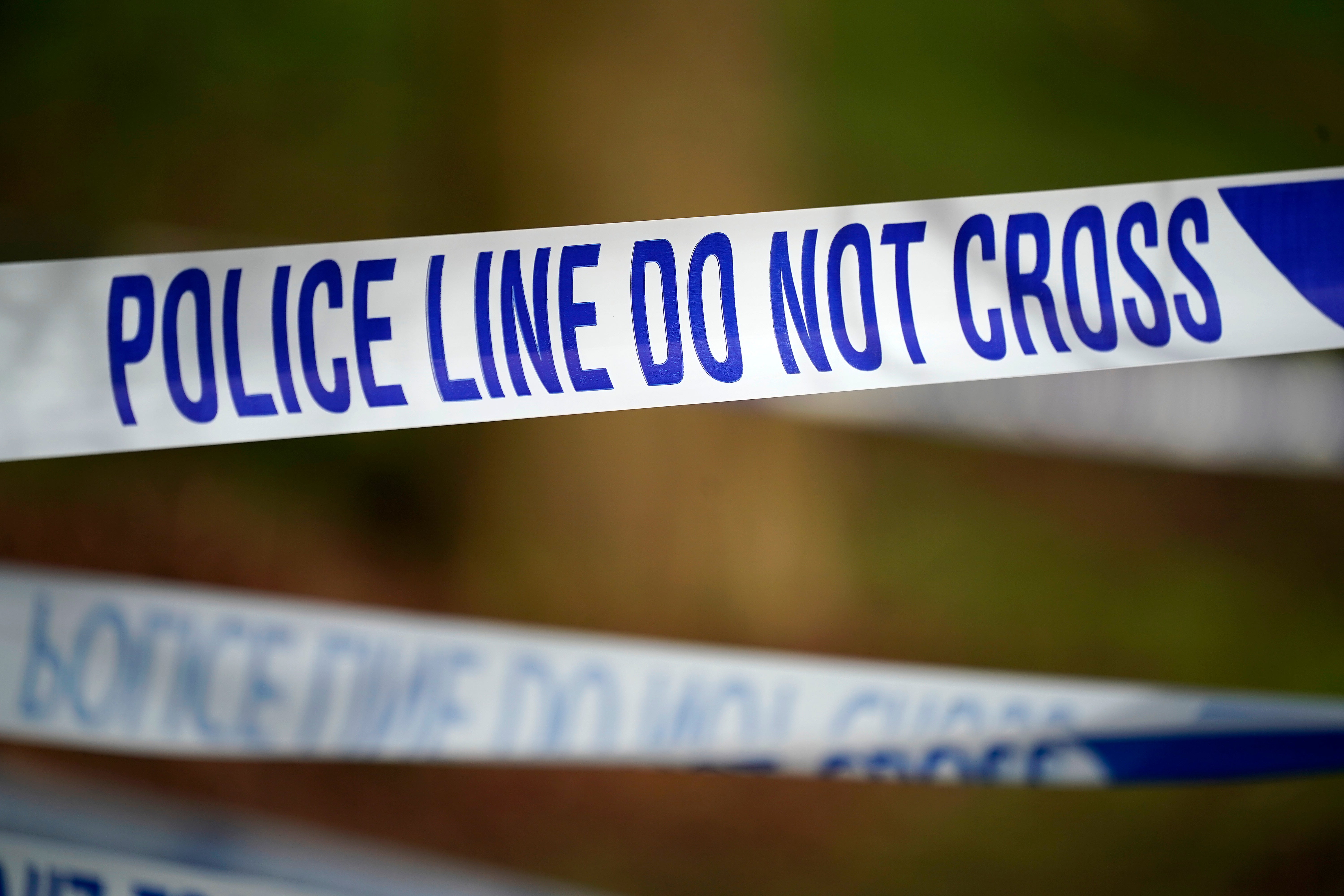 Investigations are ongoing into a fire which killed a woman in Manchester