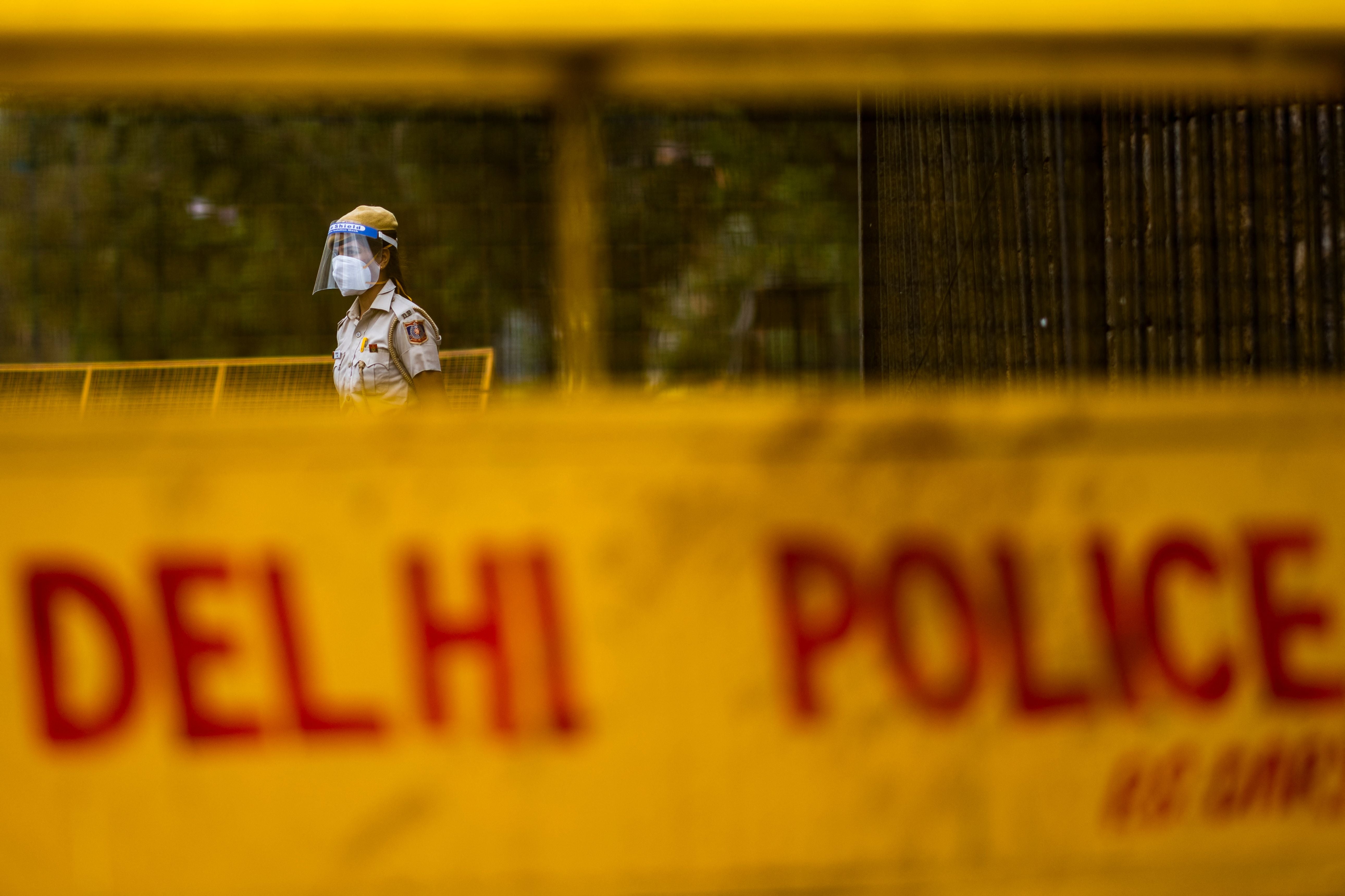 A police officer stands guard at a roadblock in Delhi on 20 April, 2021. Representative image.